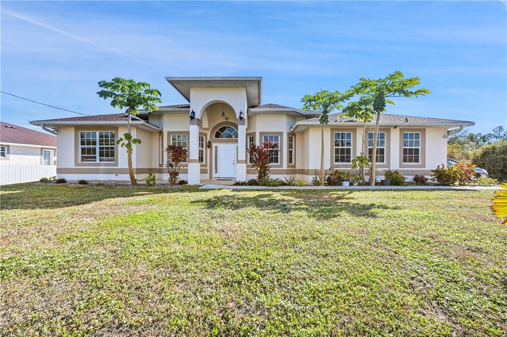 Come enjoy your beautiful lifestyle in the verywelcoming community in Lehigh Acres. This well-maintained property offers an oversized driveway, an oversized garage door, an oversized lot,high ceilings, tray ceilings, and many more features. The location is in a strictly residential neighborhood within minutes from yourneighborhood supermarkets, grocery stores, restaurants, gas stations, and other businesses.