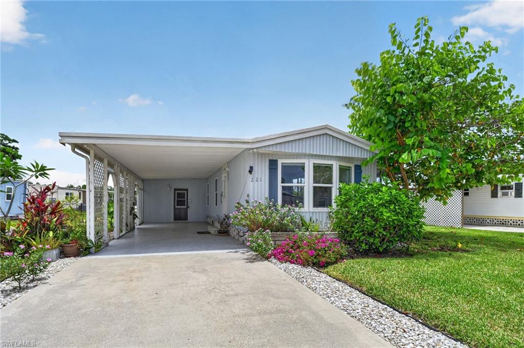 Adorable home in the fun-festive community of West Wind Estates.  This 2 bedroom home has been beautifully updated.  Lighting, flooring, cabinets, quartz counters - everything is new.  The home features a washer/dryer indoors, an oversized storage room or workshop, and a lovely screen room to enjoy your morning coffee or evening cocktail.  West Wind Estates is a fun, pet friendly 55+ neighborhood with so many activities to keep you busy including pickleball, shuffleboard, corn hole, game nights, monthly brunches, and too many celebrations to mention. You own the land and the community fees are a very low $125/mth. No lot rent!!! Home is located just 12 miles from either downtown Naples or Marco Island each with great beaches, restaurants, and shopping.