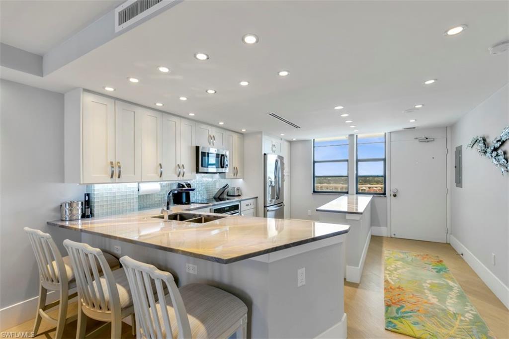 Embrace the island lifestyle in this completely remodeled and tastefully decorated condo on the beach. The spacious and bright open floor plan offers 2 beds and 2 baths capturing magnificent views of the ocean. The kitchen features unique high end granite countertops, stainless steel appliances, recessed lighting, and ample cabinet storage. Step onto the large dual entry balcony to take in the ocean breeze and southern view from crescent beach to Cape Marco. Both bedrooms are generously sized and offer large windows and neutral flooring throughout. The master bedroom includes a built-in wardrobe, private ensuite bath, and direct balcony access. The central bathroom exudes luxury, and features a large shower with unique pebble details, a mirrored vanity, and automatic under cabinet lighting. Located in the coveted, gated community of South Seas Tower 1, this unit allows weekly rentals–a great opportunity for an investor! There is also a dock available for rent just moments away in Clam Bay! Experience true paradise living with small-town character. In proximity to restaurants, shopping, beaches, and recreation–this residence will not last long!