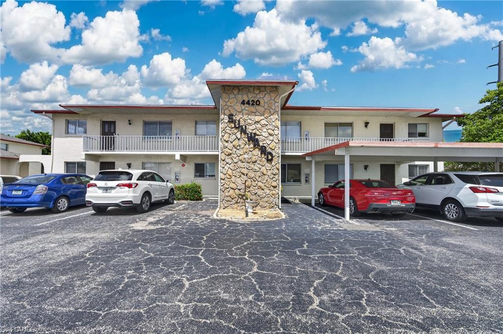 Welcome to Sunward, a well-maintained community ideally situated on Santa Barbara Boulevard in the heart of Cape Coral. This 2-bedroom, 2-bathroom second-floor corner unit offers just under 1,200 square feet of comfortable, updated living space plus a private screened balcony lanai — and delivers a combination of natural light, modern updates, and practical amenities that most condos at this price point simply cannot match.
The corner unit location is a genuine advantage — additional windows in the dining, kitchen, and living areas flood the home with natural light throughout the day, creating a bright and airy atmosphere that immediately sets this unit apart from interior units in the building. Plank tile flooring runs through the main living areas, creating a clean, modern foundation throughout. The updated kitchen features freshly painted cabinets, quartz countertops, a tile backsplash, and includes all appliances — refrigerator, dishwasher, washer, and dryer — plus a garbage disposal and a tankless water heater installed less than a year ago. Every practical update has already been done.
The primary bedroom suite is generously sized, featuring sliding glass doors that open directly to the screened balcony lanai, a large walk-in closet, and an en-suite bathroom with a walk-in shower. New water valves and a new toilet were recently installed in the primary bath. The guest bedroom is equally well-appointed with a full bathroom and updated vanity — ideal for families, seasonal visitors, a dedicated home office, or long-term guests. New tile in the entry foyer adds a polished first impression from the moment you step inside.
Owners at Sunward enjoy access to a private pool surrounded by green space at the center of the complex — a peaceful retreat that keeps the lifestyle comfortable without the maintenance demands of a single-family home. Assigned parking is included.
The location is as strong as the value. Situated on Santa Barbara Boulevard, you are moments from Cape Coral Parkway with its restaurants, shopping, and dining, and have easy access to Fort Myers via both bridges. Everything Cape Coral has to offer — waterfront dining, entertainment, parks, and the growing South Cape district — is within easy reach.