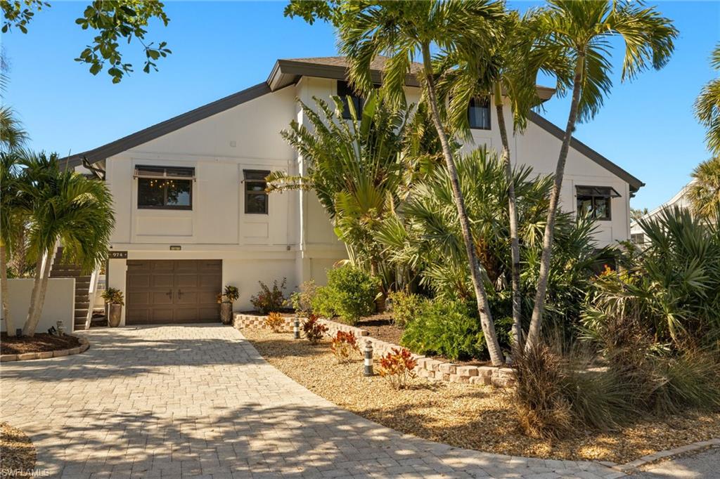 Looking for an affordable beach property on Sanibel? Your search ends here! This modern, coastal-inspired townhouse is the perfect retreat, offering the ideal combination of serenity, nature, and an unbeatable location on the sought-after east end of the island. Located on a quiet dead-end street surrounded by lush woods, this beautifully updated 3-bedroom, 2.5 bathroom home provides the perfect escape from the everyday hustle, offering a peaceful slice of island life. Step inside to a bright and airy space, where sleek white and grey modern tile floors, soft light grey walls, and vaulted ceilings create a calming atmosphere. White shiplap accents and skylights amplify the spacious, open feel of the home, while large impact windows and doors invite abundant natural light and provide peace of mind during stormy weather. The heart of the home is the fully remodeled kitchen, featuring brand-new white craftsman-style cabinetry, warm grey granite countertops, and stainless-steel appliances. Whether you’re cooking a simple meal or hosting guests, this kitchen has everything you need to inspire your inner chef. Located in the desirable Dunes neighborhood, this townhouse offers a rare combination of privacy and convenience. Tucked away from the main roads, yet still just a short walk from all that the island has to offer. Whether you’re in the mood for a relaxing beach day, a delicious meal at one of the nearby restaurants, or a leisurely bike ride along scenic paths, everything is within easy reach. Picture yourself starting the day with coffee on your screened-in porch, taking in the peaceful views of the surrounding woods. The sounds of birds and rustling leaves create a perfect natural soundtrack to your morning. Then, step outside for a quick 5-minute walk to the beach, where you can bask in the sun, hunt for seashells, or enjoy a breathtaking sunrise over the Gulf of Mexico. Afterward, take a short bike ride to explore the island, stop for lunch at a nearby café or check out local shops. The charm of Sanibel’s relaxed pace is the ideal complement to this wonderful home, making it feel like a vacation every day. This townhouse isn’t just a place to live, it’s a lifestyle. Whether you’re soaking in the beauty of your surroundings, spending the day at the beach, or simply unwinding at home, this is the life you’ve always dreamed of. With its prime location, private setting, and thoughtful updates, this home truly embodies the essence of island living at its best. Come see for yourself and experience what it means to live in paradise. This townhouse offers more than just a place to call home, it’s the perfect setting for enjoying everything Sanibel has to offer. Make it yours today!