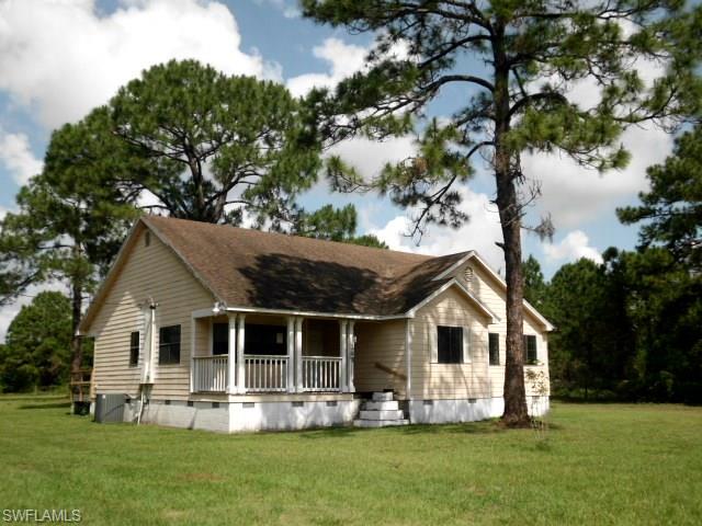 Need an acre, with a home & a barn?  We have it!  Located E of LaBelle this home was built in 1993 and offers 3 bedrooms, 2 baths, an eat in kitchen, formal dining room, interior laundry, large family room, and over 1700 sq. ft. of living space.  Enjoy the covered porches, fenced yard quiet country living.  Just minutes from Clewiston with easy access to County Rd 833 and State Route 80.  Make your appointment today.