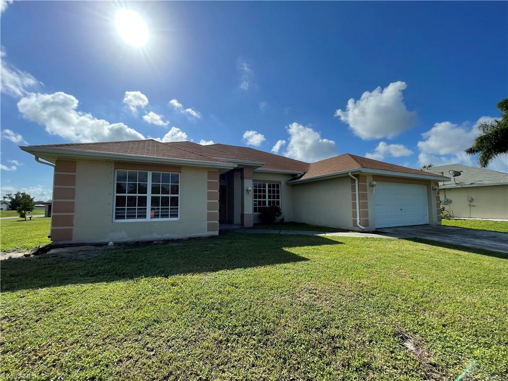 SELLER WILL BE INSTALLING TILE AND CARPET PRIOR TO CLOSING! NOW ELIGIBLE FOR FHA AND VA! HUGE 4 bedroom 2 bathroom home situated on an oversized lot located in Southwest Cape Coral! This home is over 2300 square feet! Privacy from neighbors across the street, right next to Emerald Cove Gated Community! VERY quiet neighborhood surrounded by beautiful homes. THE SIDE LOT IS GIGANTIC! Partially fenced in backyard for dogs or kids to play! Inside features 3 guest bedrooms, large master bedroom with large master bathroom, guest bathroom, dining room, HUMONGOUS living/family room with vaulted ceilings, formal dining room, large breakfast nook, kitchen with LOTS of counter and cabinet space, huge indoor laundry room, and tons of storage space! Inside recently completely painted!