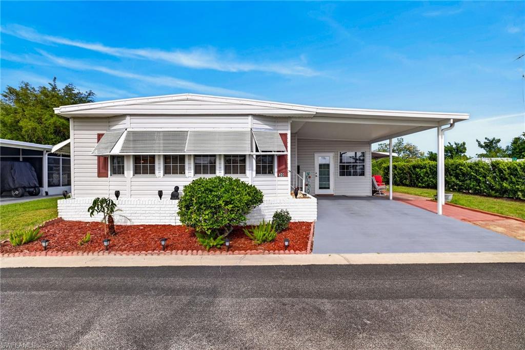 Welcome to your slice of paradise on the Caloosahatchee River! Located in a vibrant 55+ riverfront community, this one checks all the boxes for easy, active Florida living. Enjoy Gulf access, a marina with boat slips, fishing pier, boat & RV storage, and a beautiful clubhouse featuring a pool, fitness room, and a full calendar of social activities, all with LOW HOA fees! This move-in-ready home is priced right and offers incredible space with 2 bedrooms, 2 bathrooms, plus a den/office and inside laundry. Originally 1,038 sq ft, a well done addition expands the living area to approximately 1,600 sq ft, giving you the flexibility you’ve been looking for. Step inside to a bright, open layout filled with natural light. The spacious kitchen is a standout with solid wood cabinets, updated stainless steel appliances, and a center island perfect for entertaining. You’ll love the upgraded finishes throughout, including travertine tile, stylish backsplash, wood blinds, and full drywall there is no paneling here! Major updates provide peace of mind: newer A/C, newer mini-split system, whole-house generator, metal roof, newer water heater, and an upgraded electrical panel. Outside, there’s even more to love with an attached golf cart garage and workshop area which is perfect for hobbies, storage, or tinkering. And the best part? This home has NEVER flooded and is NOT located in a flood zone. Affordable, updated, and packed with lifestyle amenities this is Florida living at its best. Don’t miss your chance to make it yours!