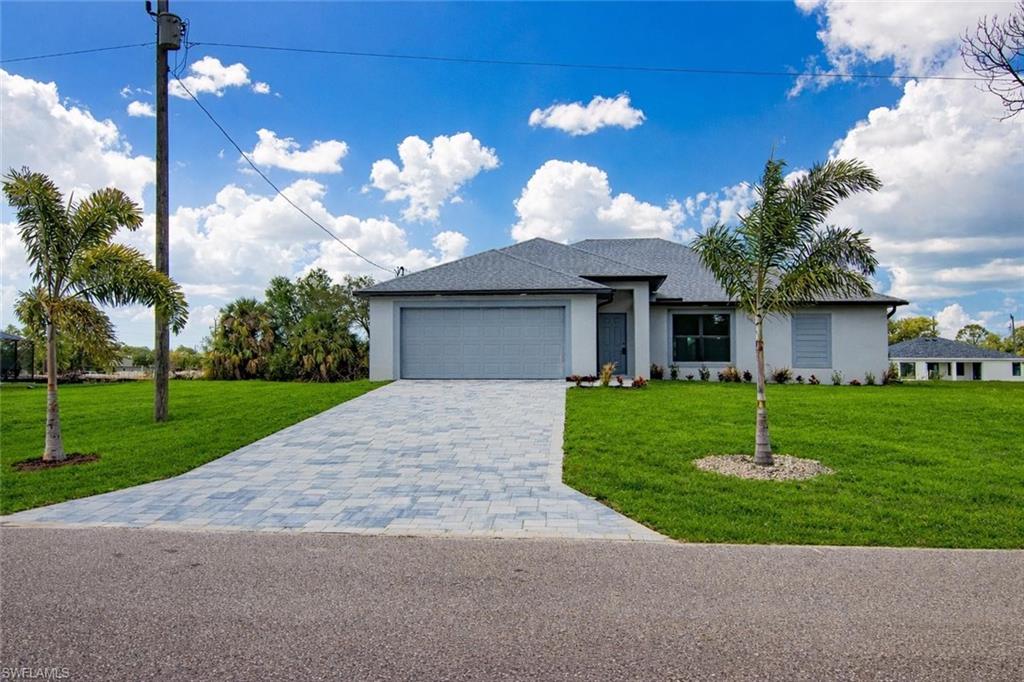 This is a MUST SEE! BRAND NEW WATERFRONT HOME WITH 4 BEDROOMS, 2 FULL BATHS, TWO CAR GARAGE, AND UPGRADES! Fantastic, OPEN floor plan with CATHEDRAL CEILING, sliders to the outside, split bedrooms and a pool bath! Plenty of room to add a future pool. Wonderful neighborhood with new homes all around, convenient to parks, restaurants, shopping, schools, boat ramps, golf & more! Enjoy the peaceful canal views with lots of wildlife! Beautiful TILE floors with carpeted bedrooms! All 4 bedrooms have TRAY CEILINGS and ceiling fans/lights! EXTENDED LANAI with dual ceiling fans/lights! The island kitchen is GORGEOUS with quartz tops, stainless steel appliances and a pass-thru window to the lanai! The master suite has a big TRAY ceiling, sliders to the lanai and two WALK-IN closets! The master bath has a tiled shower, quartz tops with dual sinks and a separate commode area! Inside laundry room with washer, dryer, shelving and a pantry! Plenty of STORAGE in this home! PAVERED driveway, walk-way and front porch! Built-in lights in the soffits too! NO FLOOD INSURANCE REQUIRED HERE! This home is priced right and 100% of the proceeds will go to CHARITY! Don't miss this exceptional opportunity to own this fantastic waterfront at an affordable price!