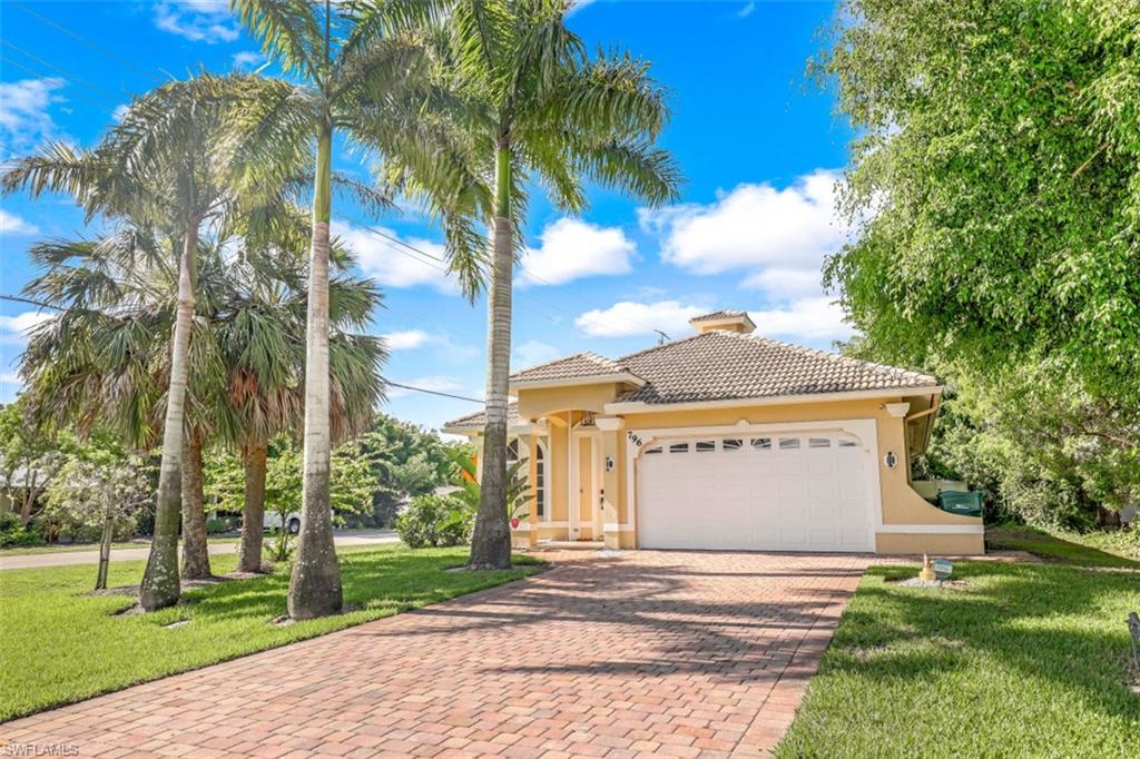H6293. Southern Exposure at its best with no neighbor to one side, walk to the beach from this Beautiful 3 Bedroom, 2 Bath great room home with complete hurricane protection and a completely fenced in back yard.   This fabulous light and bright home is ready to be enjoyed and shared with family and friends with plenty of outdoor living space.   Great size pool to splash after your round of tennis or walk to the beach. Features and enhancements include new air conditioner, lawn irrigation is on a well, 2020 garage door, 2020 lanai screens, 2019 garage A/C (Mitsubishi), dual-zone wine beverage refrigerator, newer hot water tank & pool heater, wine & beverage bar, granite kitchen counters, closet systems. The best part of living in Naples Park is NO HOA fees, walk to Publix, Whole Foods, LA Fitness is around the corner, a short bike ride to Delnor Wiggins State Park or enjoy dinner at the Turtle Club with toes in the sand. Only a few blocks away you will enjoy Pelican Bay community park where you will find tennis courts, playground for the children and walking trails. Location, Location, Location and very desirable area to enjoy for the season with the easy beach access. Welcome Home!