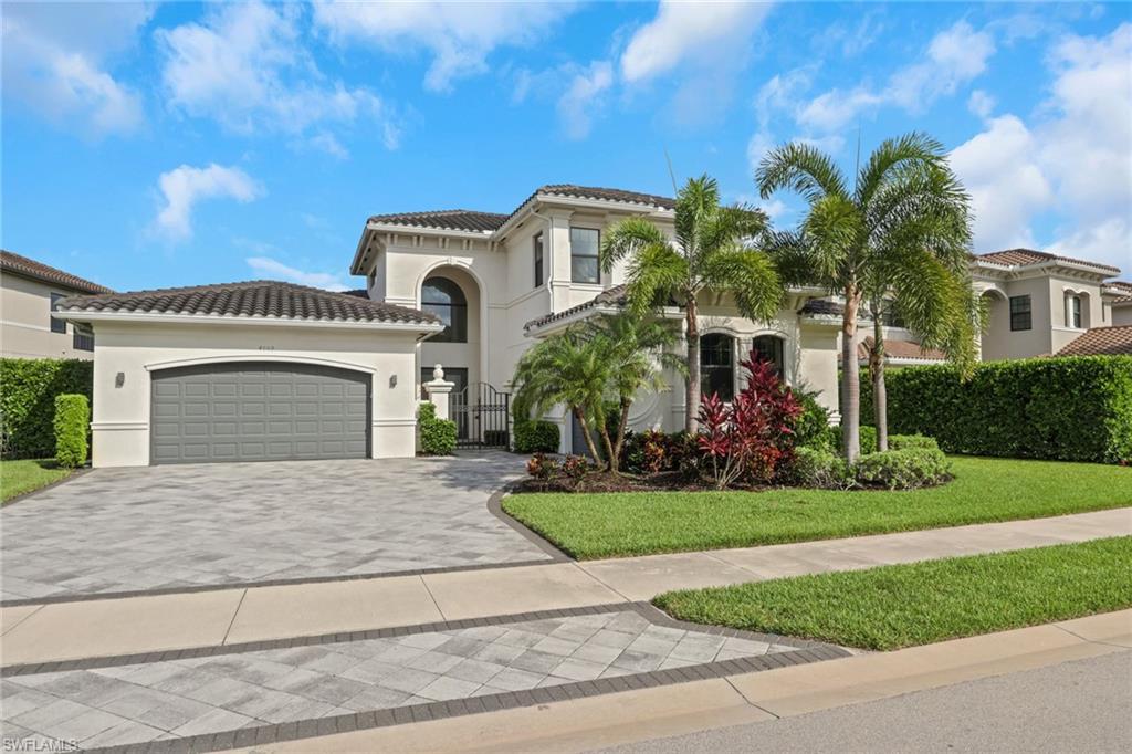 One or more photo(s) has been virtually staged, AI generated or rendered.  Welcome to 4509 Azalea Drive, an exceptional Carlyle Grande floor plan residence in StoneCreek, one of Naples most sought-after gated communities. This beautifully upgraded 4-bedroom + den + loft, 4.5-bath pool home offers the perfect blend of luxury, functionality, and resort-style living in a top-rated school district. From the moment you step inside, you'll appreciate the bright open-concept floor plan, soaring ceilings, abundant natural light, and thoughtfully designed living spaces. Contemporary finishes blend seamlessly with timeless elegance, creating a home that is both sophisticated and welcoming. At the heart of the home is the chef-inspired kitchen, featuring natural gas cooking, stainless-steel appliances, quartz countertops, custom cabinetry, island with a vegetable sink, and abundant storage. The kitchen flows effortlessly into the great room and dining area, making it ideal for everyday living and entertaining. The private first-floor den, complete with its own separate entrance, offers incredible flexibility as a home office, library, fitness room, art studio, or guest retreat. Upstairs, the spacious loft provides additional living space and can easily function as a media room, playroom, second family room, home office, or guest lounge. The primary suite serves as a private retreat, featuring two walk-in closets, dual vanities, a soaking tub, and a walk-in shower. Designer upgrades are found throughout the home, including upgraded tile flooring throughout the first floor, custom accent walls with built-in storage, crown molding, custom closet systems, designer lighting imported from Italy, and thoughtfully curated finishes that elevate the home's contemporary coastal aesthetic. Step outside to your private outdoor oasis. The western-facing screened lanai provides the perfect setting to enjoy breathtaking sunsets while overlooking the resort-style pool. The generous outdoor living space is ideal for relaxing or entertaining year-round. Additional highlights include a three-car garage, spacious driveway, dual-zone HVAC systems, natural gas, and extensive custom storage solutions throughout the home. StoneCreek is one of North Naples' premier natural gas communities and offers an unmatched amenity package, including a resort-style pool, lap pool, spa, fitness center, indoor basketball court, tennis courts, pickleball courts, playground, splash park, billiards room, social gathering spaces, and a full-time activities director coordinating year-round events. Residents enjoy 24-hour guard-gated security, low HOA fees, and no CDD. Ideally located just minutes from Naples' world-class beaches, Mercato, Waterside Shops, Seed to Table, fine dining, shopping, golf, hospitals, and SWFL Int Airport. This exceptional residence offers a lifestyle defined by luxury, convenience, and resort-style living in one of North Naples' most prestigious and desirable communities.