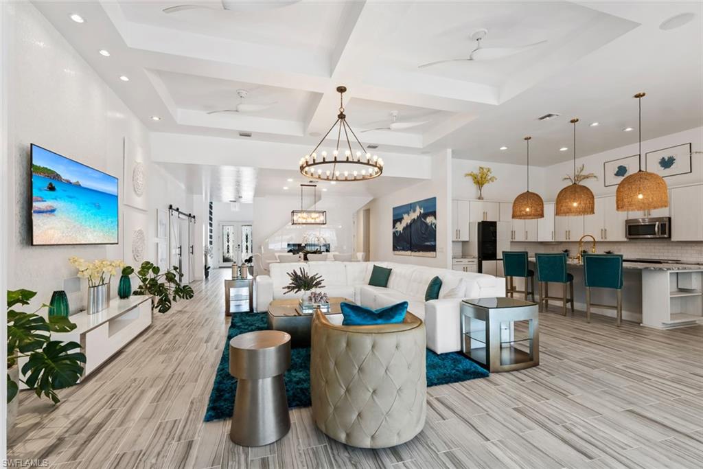 Elegance and comfort come together in this beautifully maintained home in the gated community of Corkscrew Shores. Featuring 4 bedrooms, 4 bathrooms, and 3,923 square feet of thoughtfully designed living space, this residence offers the perfect balance of luxury, functionality, and Florida lifestyle. From the moment you step inside, you'll appreciate the bright, open concept layout, enhanced by fresh interior paint, plantation shutters, updated lighting, designer ceiling fans, and beautiful new flooring throughout. A private office with French doors creates the perfect work from home space, while the spacious living and dining areas flow seamlessly into the heart of the home. The gourmet kitchen is designed for both everyday living and entertaining, featuring updated appliances, generous counter space, and abundant cabinetry. Thoughtful upgrades such as a Culligan whole home water filtration system, tankless water heater, and solar panels add comfort, efficiency, and long term value. Step outside to your own private backyard retreat, where a sparkling saltwater pool with upgraded lighting, an expanded paver lanai, lush landscaping, and outdoor kitchen invite you to relax or entertain year round. Electric hurricane shutters on the front entry and lanai window provide added convenience and peace of mind, while the freshly painted exterior, epoxy-coated garage floor, and painted garage walls reflect the pride of ownership found throughout the home.Beyond your front door, Corkscrew Shores offers an exceptional resort style lifestyle with a spectacular clubhouse, lakeside restaurant and bar, fitness center, resort-style pool and spa, tennis, pickleball, bocce, kayaking, a fishing pier, scenic walking trails, and a full calendar of social activities. Ideally located in the heart of Estero, you'll be just minutes from SWFL International Airport, premier shopping, top rated dining, championship golf, and award winning white sand beaches. This is more than a home. It's the lifestyle you've been waiting for.