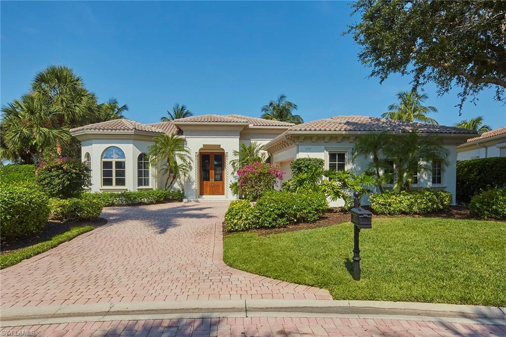 What an incredible long-range panoramic double fairway view from this spacious four-bedroom plus study, 4.5 bath luxury villa in the prestigious Venezia neighborhood in Grey Oaks. The soaring ceilings through the double mahogany entry doors greet you as you enter this open airy home into a conversational living room featuring slate floors. A stunning updated white kitchen complete with quartzite countertops, dual sinks, large island and gourmet gas cooktop is sure to please any discerning chef. The open kitchen leads to the family room filled with natural light through sliding glass doors that open to two separate covered loggias, and the heated pool and spa perfect for entertaining friends and family. Additional updates include a brand new roof, new gas pool heater, tankless water heater and epoxy garage floors. A world of luxury awaits you at Grey Oaks Country Club with its world-class amenities and three championship golf courses.