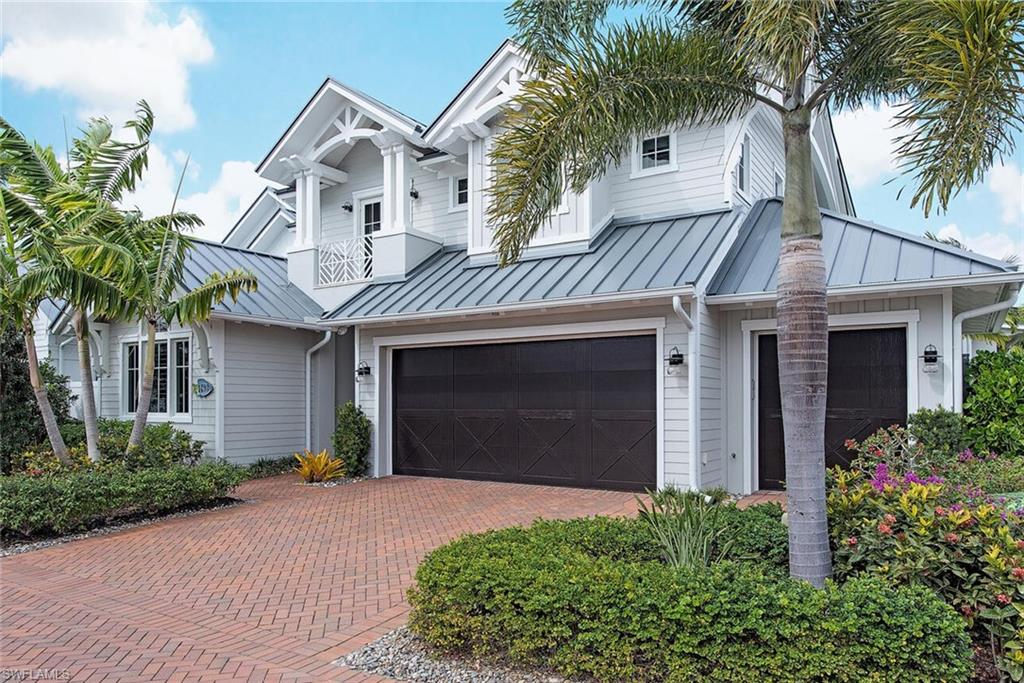 Ready to move in! Custom designed by MHK architects to fit perfectly on this oversized corner lot in Old Naples. A unique 3 bay garage with electric car charger. Beautifully designed and furnished with incredible detail to create a warm and loving home. Spacious outdoor living features a private heated pool and spa, lanai with roll down screens and shutters, summer kitchen, as well as a deeded boat slip offering access to the Gulf of Mexico. 2 bedrooms (including the owners suit) plus a den on the first floor and 2 en-suit guest rooms upstairs. The gourmets kitchen features Cristallo countertops, Ruffino cabinetry, and top of the line appliances; 6 burner gas WOLF oven, 42' Sub-Zero fridge. The 2nd story includes a living room and wet bar. This home is full CBS construction on both floors. Mangrove Bay sits on the Gordon River surrounded by all of the amenities Old Naples has to offer within walking distance including; 5th Avenue South shops, the beach, Baker Park (dog park), and the new Gulfshore Playhouse and Baker Theater. Mangrove Bay also offers a community center perfect for meeting neighbors and features a wellness center and fitness room, and kayak/paddleboard storage.