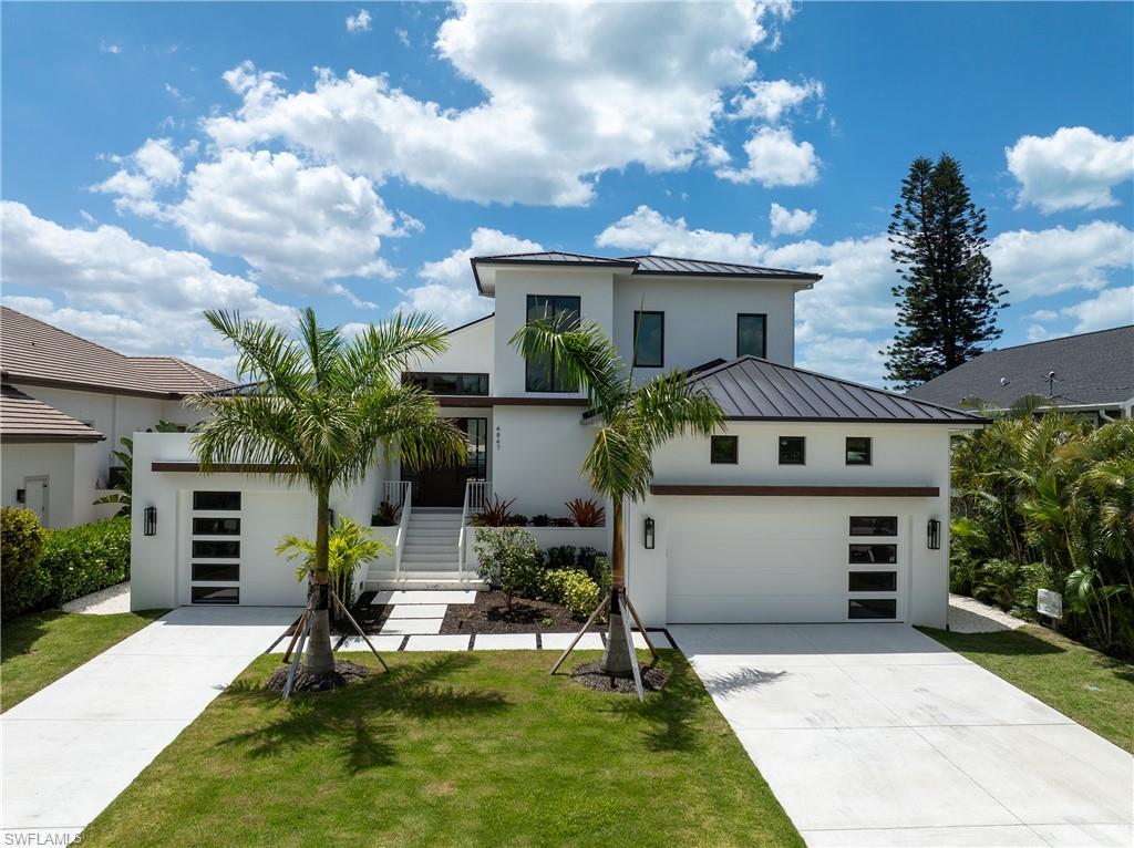 One or more photo(s) has been virtually staged, AI generated or rendered.  
A home built for those who expect nothing less than extraordinary. Stunning new construction waterfront estate in Bonita Springs offering 4BR + 4.5BA and over 3,300 sq ft of elevated coastal design. Built with all-concrete construction and metal studs for lasting quality and peace of mind.
Bright, open floor plan with volume ceilings and custom beams, a showpiece chef’s kitchen with white oak cabinetry, quartz countertops, and Monogram appliances, and a dramatic double-sided gas fireplace that seamlessly connects indoor and outdoor living.
Step outside to your private retreat featuring a resort-style pool and spa with a premium shell stone deck, covered lanai, and rooftop balcony with breathtaking sunset views.
Boater’s dream location on a deep-water canal with two private slips, no bridge height restrictions, and quick Gulf access.
Loaded with upgrades including whole-home Lutron automation, electric hurricane shutters, motorized screens, whole-house generator, and natural gas service. Elevated major systems for added protection.
Luxury, location, and lifestyle—this one checks every box.