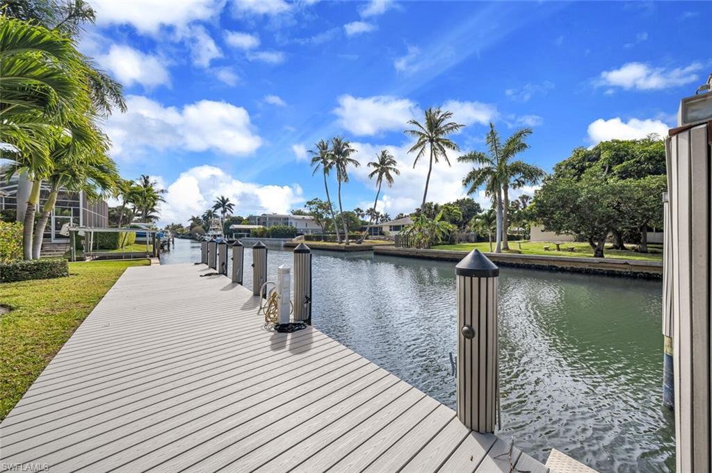 Beautiful home with southern exposure in sought after Aqualane Shores! Ideally located just minutes from 5th Ave. South's and 3rd St. South's fine dining, world-class shopping, entertainment and white sand beaches.