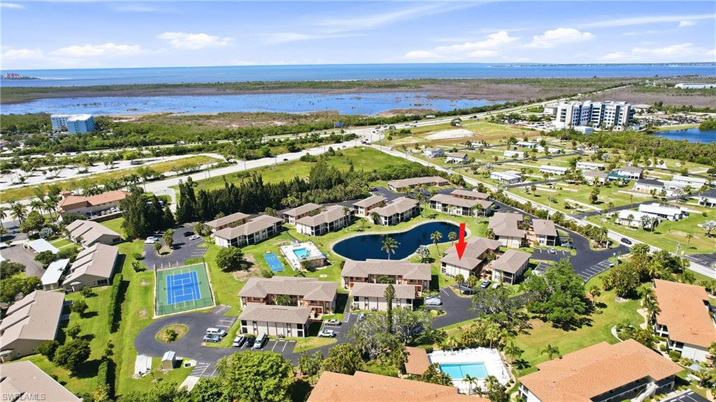 Island Living Starts Here — Minutes from Sanibel & Fort Myers Beach!

Wake up to the easy, breezy lifestyle you've been dreaming of. This beautifully renovated first-floor condo puts you just minutes from the Sanibel Causeway and only 10 minutes to the sugar-white sands of Fort Myers Beach — island hopping becomes part of your everyday routine
Step inside to find a top-to-bottom transformation with level 3 finishes throughout. New tile flooring flows seamlessly across the entire home, complemented by quartz countertops and upgraded cabinetry that give every room a fresh, elevated feel. The fully remodeled bathrooms continue the theme with new tile, quartz counters, and modern fixtures.

No stairs, no hassle — this ground-floor unit offers effortless, single-level living. Unwind on your screened lanai as you take in peaceful views of the pond, pool, and tennis/pickleball courts, your own private retreat after a day at the beach.

Davis Wood Condominiums delivers resort-style ease with quick access to Sanibel Island, Fort Myers Beach, and endless shopping and dining options nearby. With one assigned parking space plus an additional permitted spot, coming and going is simple.

Whether you're searching for a slice of paradise to call home or a lock-and-leave retreat near the water, this is coastal living made easy.