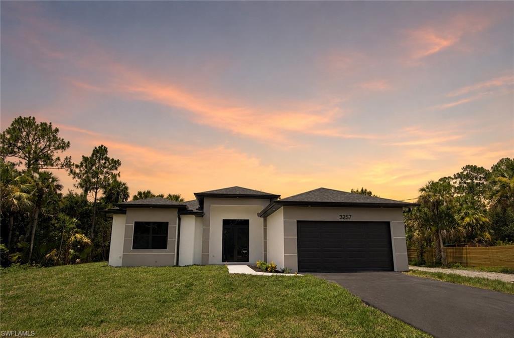 Welcome to your private estate in the heart of Golden Gate Estates! This 2,004 sq ft home features 4 full bedrooms and 2 bathrooms. Situated on a generous 2.34-acre homesite, this beautifully designed residence offers the perfect blend of luxury, space, and privacy. Surrounded by a picturesque natural setting with mature native vegetation, the property provides a peaceful retreat while offering endless possibilities for outdoor living.

The thoughtfully designed floor plan features an open, spacious layout enhanced by soaring 10-11 foot ceilings throughout, creating an inviting and airy atmosphere. High-end finishes, quality craftsmanship, and elegant details are showcased in every room, making this home as functional as it is beautiful.

Step outside to the expansive covered lanai, an ideal space for entertaining or simply enjoying the tranquility of your private backyard. With 2.34 acres of land, there is ample room to add a custom pool, detached garage, workshop, barn, RV storage, or even a guest house while still maintaining exceptional privacy.

Whether you're looking for a luxury family home, room for your hobbies, or the flexibility to expand in the future, this exceptional Golden Gate Estates property offers the space, quality, and lifestyle you've been searching for.