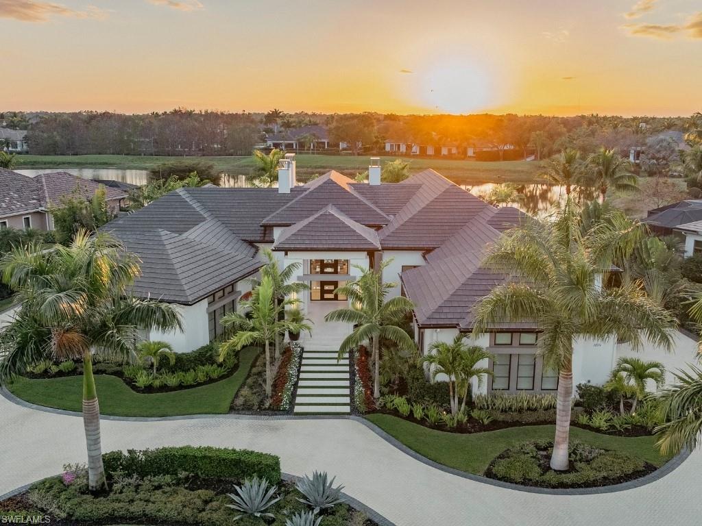 Immediate Golf Membership Available. Positioned on one of the most coveted western-facing homesites in Quail West, this architecturally significant estate captures sweeping sunset views over both water and golf—an offering rarely found in Naples. Custom designed by John Cooney of Stofft Cooney Architects and appointed with bespoke Ruffino cabinetry, this residence was built to deliver effortless luxury and unforgettable entertaining on a grand scale.

From the moment you arrive, every detail reveals intention—from the infinity-edge pool reflecting the evening sky to curated interiors featuring a hardwood-clad office, hidden doors, a sculptural marble powder bath, and statement lighting throughout. Designed for both comfort and impact, the home seamlessly blends indoor and outdoor living, welcoming intimate evenings or gatherings of 150+ guests with ease.

A fully integrated smart home system elevates daily living—transforming lighting, music, security, and ambiance with a single command. Whether arriving home or departing for travel, the residence adapts instantly, offering both sophistication and peace of mind. 

Beyond its design, the lifestyle is unmatched. A walk-in wine cellar, soundproof media room, mirrored fitness studio, waterfall-accented putting green, full catering kitchen, and dual laundry rooms create a home that is as functional as it is striking. An oversized four-car garage with lift and workspace completes the experience.

Set within amenity-rich Quail West—one of Naples’ most prestigious private club communities—residents enjoy two championship golf courses, an elegant clubhouse, multiple dining venues, 6 tennis and 8 pickleball courts, fitness and spa facilities, and a vibrant social calendar.

This is more than a home—it is a statement. Designed for those who value architecture, automation, and the art of entertaining, it offers a level of lifestyle that is rarely available and impossible to replicate.

Private sunset showings available by request.