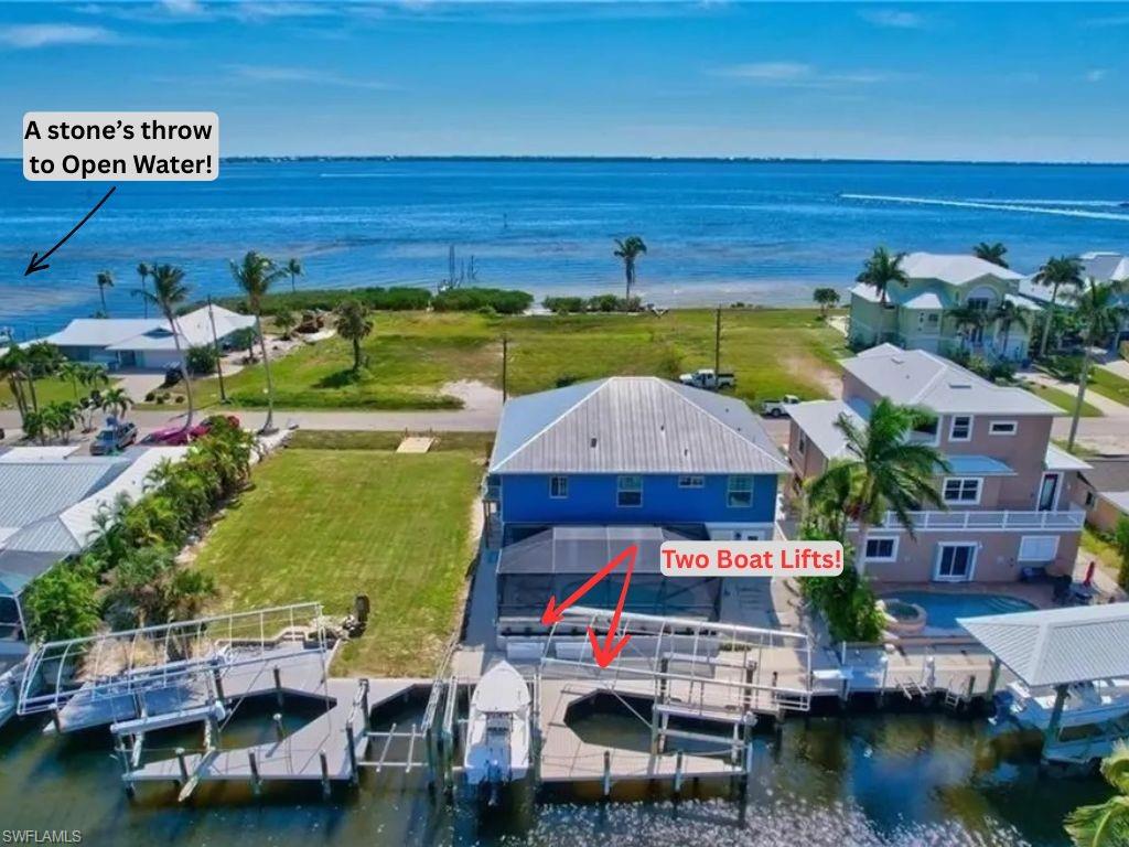 LOCATION LOCATION LOCATION! Your Slice of Paradise Awaits! Step into this fully furnished, turnkey waterfront masterpiece and prepare to be swept away by breathtaking panoramic views of Pine Island Sound and Sanibel Island. Nestled in one of Southwest Florida’s most coveted locations, this gulf-access pool home is a rare gem that blends luxury, comfort, and island charm. Interior Elegance Meets Coastal Chic Every inch of this home is thoughtfully designed with beachy, nautical décor that instantly transports you to vacation mode. The gourmet kitchen is a chef’s dream, featuring Cambria Quartz countertops, GE High-Profile stainless steel appliances, and a layout perfect for entertaining. Peace of Mind & Premium Upgrades Enjoy the security and style of a metal roof, impact-resistant windows and doors, plank tile flooring, and plantation shutters throughout. A new AC keeps things cool, while the shiplap lanai ceiling adds a touch of coastal sophistication. Outdoor Living at Its Finest Sip cocktails from your screened balcony as dolphins and manatees glide by. Take a dip in the heated saltwater pool, then unwind with the best sunsets in SWFL. With two covered boat lifts (14k & 7k lbs.), composite docks, and a fish cleaning station, your waterfront lifestyle is ready to launch. Island Adventures & Ultimate Convenience - Hop in your included golf cart (valued at $20K and loaded with extras) and explore nearby amenities, or cruise on your boat to local islands and beaches for world-class fishing and relaxation. This is more than a home—it’s a gateway to the island life you’ve always dreamed of. Fall in Love. Move to Paradise. Whether you're seeking a serene retreat or a vibrant coastal lifestyle, this home delivers it all. Don’t just buy a house—claim your piece of paradise.