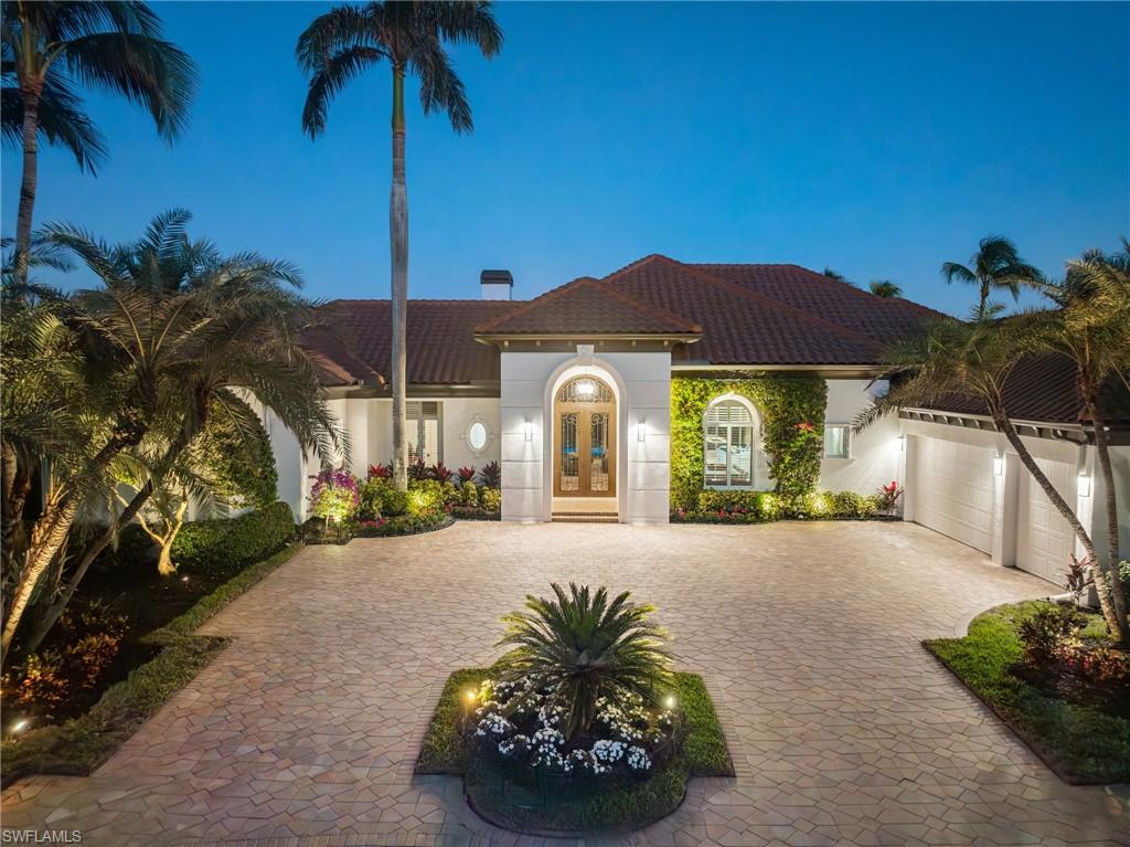 Situated on a premium cul-de-sac waterfront lot in prestigious Grey Oaks, this exquisitely renovated 4-bedroom plus study, 4.5-bathroom home spans over 4,800 square feet of refined living space. This home is a rare find and priced to sell. Offering sweeping 180-degree views of the lake and golf course, the home’s open floor plan seamlessly connects indoor and outdoor spaces, making it ideal for entertaining or enjoying Naples’ luxurious lifestyle within the exclusive Grey Oaks community. Every detail of this residence has been meticulously maintained or thoughtfully updated. The current owner introduced a high-end kitchen with Miele appliances, a custom wine room, walnut hardwood floors, and a modern fireplace. Significant updates elevate the home’s functionality and design with a new roof, gutters, and a complete A/C system replacement (still under warranty). Additional enhancements to the outdoor spaces included retractable lanai screens and a state-of-the-art security camera system. The outdoor living area was transformed in 2023, featuring a resurfaced pool, new pool deck, updated equipment, and a stunning outdoor grill area. New lanai flooring and fans further enhanced this serene space designed for relaxation and entertainment. Most recently, the primary and guest bathrooms and the powder room were updated, showcasing exceptional craftsmanship and impeccable design. The exterior received a fresh coat of paint, ensuring the home is as visually stunning as it is functional. Located in one of Naples’ most coveted communities, Grey Oaks offers an unparalleled lifestyle. Residents enjoy access to three championship golf courses, two elegant clubhouses, a poolside restaurant, tennis and pickleball courts, a cutting-edge fitness center, and more. This is more than just a home, it’s a gateway to luxurious living at its finest. A must see!