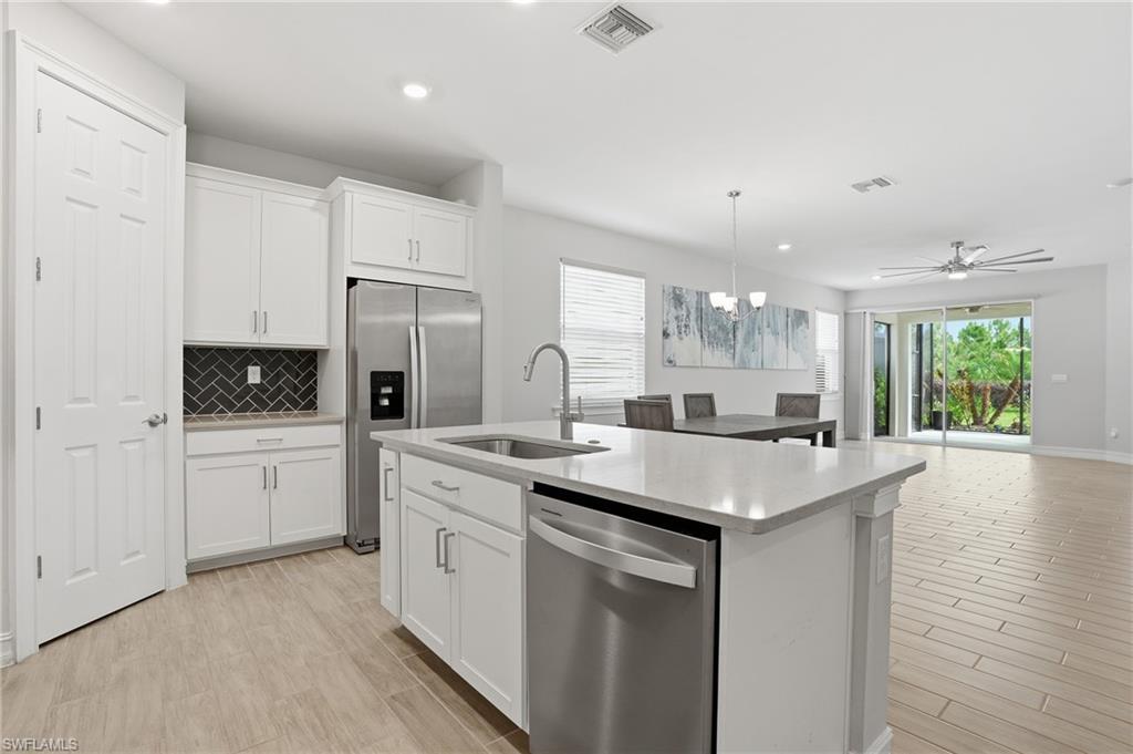 Discover the Ariel floor plan in Seasons at Bonita — a bright, low maintenance homes backing up to protected preserve land for privacy and peaceful nature views. This 2022 built home features an extended screened lanai with an included hot tub for year round relaxation, a unique, oversized 31 foot deep garage big enough for a small boat, jet skies or golf cart, and thoughtful indoor living spaces with abundant natural light. Enjoy low HOA dues and added peace of mind. The property is NOT located in a flood zone potentially saving thousands of dollars a year. Seasons offers great amenities including pickleball, tennis, bocce, gym, resort pool, lap pool, hot tub and two dog parks. Don't miss this move in ready homes ideal for anyone seeking comfort, convenience, and privacy in a maintenance friendly community.
