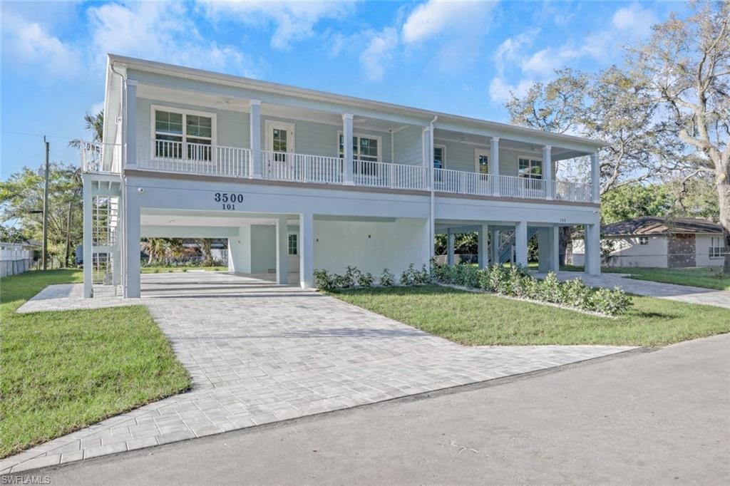 One or more photo(s) has been virtually staged, AI generated or rendered.  NOW AVAILABLE to purchase both Units 101 & 102 together. Introducing a flexible coastal compound designed for the way people truly live in Southwest Florida. Just 2 miles from the beach and nearby shopping, this brand-new construction elevated residence offers an incredibly versatile layout, perfect for multi-generational living, a private snowbird retreat, or the opportunity to live in one residence while hosting guests in or renting out the other. Unit 101 and 102 are identical but reversed, and each unit contains 3 bedrooms and 2 bathrooms. Thoughtfully built with smart coastal design, the entire structure is raised to 16 feet above sea level, significantly exceeding FEMA’s required 10-foot elevation. Built to modern coastal standards, the home is engineered for 160 MPH wind resistance and features impact rated windows and fiberglass doors designed to resist warping, rot, and corrosion. The elevated living level also features concrete block walls, creating a durable and storm resistant structure. The design emphasizes low maintenance, long lasting materials throughout, including concrete, stucco, pressure-treated wood,
composite materials, aluminum, and fiberglass. Inside each residence, you’ll find bright and open living spaces highlighted by soaring vaulted ceilings in the main living areas and a minimum 9’4” ceiling height throughout. The kitchens feature quartz countertops and stainless-steel appliances, including a glass-top range with microwave. Each unit also includes stacked washer and dryer, Tankless Water Heaters, Moen plumbing fixtures, and Kohler toilets for quality and reliability. Bathrooms showcase custom tiled showers with frameless glass enclosures and 180-degree swing doors, finished with elegant satin nickel hardware. Throughout the home, luxury composite flooring offers a soft feel underfoot while being durable and easy to maintain. Outdoor living is equally impressive with front and rear porches finished in Azek composite decking, designed to last for decades without the
maintenance of traditional wood. Below the living area, the expansive open garage offers space for up to 8 vehicles, plus a locking storage room, with the option to enclose the entire garage area or portions if desired. Whether you're looking for a coastal family compound, an income-producing opportunity, or a unique snowbird retreat, this newly constructed property offers flexibility, durability, and a lifestyle centered around Southwest Florida’s beaches and sunshine!!