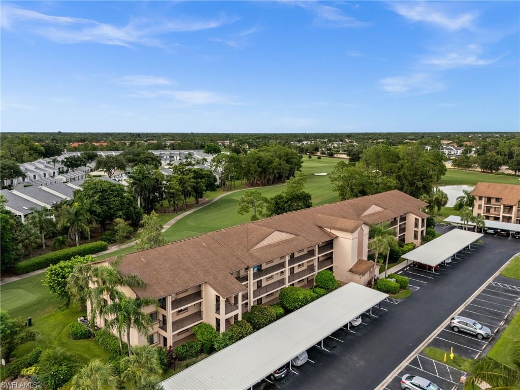 Offered turnkey and overlooking the golf course, this second floor two bedroom, two bath residence brings easy living to Country Haven inside Countryside Golf and Country Club. Arrive with a suitcase. The furnishings convey, so the home is ready for season the day you close. A bright, open plan connects the living and dining rooms to a screened lanai that frames a green, private outlook over the course. The eat in kitchen offers a pantry, a sunny breakfast nook, and a pass through that keeps the cook in the conversation. The Master Suite sits privately apart with an ensuite shower bath and a walk in closet, while the guest bedroom and bath give visitors their own space. Assigned covered parking sits steps away. Countryside recently completed a $15 million renovation, with an expanded clubhouse, a new resort style pool, dining, tennis, and pickleball, gated and minutes from downtown Naples, Fifth Avenue South, and the beaches.