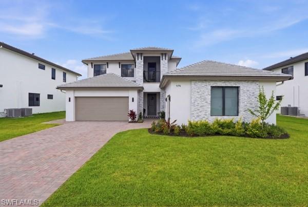 Welcome to this beautifully upgraded, newly constructed 5 bedroom 4 bath plus loft residence in the highly sought-after Maple Ridge community of Ave Maria. Thoughtfully enhanced beyond builder standards, this exceptional home offers modern luxury, functionality, and future-ready conveniences throughout.

Designed for both comfort and style, the property features a whole-house water filtration system and reverse osmosis system at the kitchen sink, providing premium water quality throughout the home. Custom ceiling fans have been installed in every room, while upgraded plumbing fixtures add a sophisticated touch throughout.

The spacious primary suite showcases an upgraded vanity, designer tile selections, a luxurious soaking tub with elegant black fixtures, and upgraded shower doors that create a spa-like retreat. The downstairs guest bathroom has been transformed into a full bathroom with a walk-in shower, complete with a custom wall niche, black waterfall showerhead, and matching upgraded sink fixtures.

Additional enhancements include an added sidewalk providing convenient access to the A/C unit, trash storage area, and fenced backyard. The fully fenced yard offers privacy and outdoor enjoyment, while the home's upgraded electrical package makes it pool-ready for future backyard customization. An EV charging outlet has also been installed, offering convenience for electric vehicle owners.

Both garages feature durable epoxy flooring, creating a clean and polished appearance while providing easy maintenance. Every detail of this home has been carefully considered, making it a truly move-in-ready opportunity in one of Southwest Florida's most desirable master-planned communities.

Experience the perfect blend of modern construction, thoughtful upgrades, and resort-style living in Maple Ridge at Ave Maria.