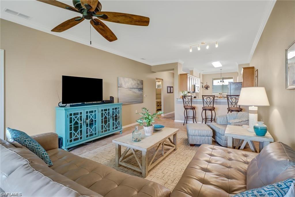 Discover your perfect retreat in this beautiful 2-bedroom, 2-bath TURNKEY furnished condo, complete with a covered carport and plenty of guest parking, located in the desirable Terraces of Riverwalk community. This pristine residence is ideally situated in a central, vibrant location, with everything you need just moments away. Inside, you'll find a spacious primary bedroom featuring a luxurious queen-size bed, a walk-in closet, and an en-suite bathroom with a vanity and walk-in shower. The bright guest bedroom offers a comfortable space for visitors with easy access to the guest bathroom and laundry room. For extra sleeping arrangements, the condo also includes a convenient twin pop-up bed—ideal for accommodating additional guests. The kitchen is a chef’s delight, bathed in natural light and equipped with modern appliances, elegant maple cabinetry, a breakfast bar, and a pantry for all your culinary needs. The open-concept living room leads to a screened lanai, offering serene views of the wooded preserve—perfect for relaxing with a morning coffee or unwinding in the evening. A dedicated laundry room with a full washer and dryer makes household chores a breeze. The building features an elevator for easy access to your unit, adding convenience and comfort. The Terraces of Riverwalk community offers an impressive array of amenities designed to enhance your lifestyle, including a sparkling resort-style pool, a relaxing spa, a fully equipped fitness center, and an inviting clubhouse. Enjoy quiet afternoons in the library, challenge friends in the billiards room, or fire up the BBQ for a fun cookout—there's something for everyone! Located just minutes from pristine beaches, Ft. Myers Beach, Sanibel & Captiva islands, fantastic shopping, and diverse dining options, everything you need is within easy reach. Extra storage outside the elevator includes beach chairs and two bicycles for your use, ensuring you have everything you need for a fun, relaxing stay. Don't miss out on this exceptional seasonal rental opportunity that combines comfort, convenience, and an active lifestyle. Make this stunning condo your home away from home!