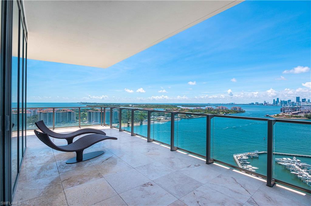 Welcome to one of the most coveted luxury high rise buildings in Miami Beach...Apogee! This unit was featured on the cover of Home Design magazine, as one of the most eclectic design styles you'll find at Apogee or quite possibly, in all of Miami! 4154 sf of opulent living space! Just 2 floors below the penthouse, you'll have breathtaking views of the bay & ocean, Miami, South Beach, Fisher Island and Port of Miami. French architect and interior designer, Michel Gamard, was instrumental in bringing this unit to life. The interior features over 19 specially selected colors, which highlight the art deco & vibe of world-renowned South Beach. Other features: private movie room, en suite bedrooms, home automation system and a climate controlled two-car garage with an abundance of storage room! This unit has unequalled ocean, city and bay views from the most prestigious building in SOFI! 2,400 SQFT 11 FT DEEP TERRACE- Breathtaking Sunsets/Miami Skyline!