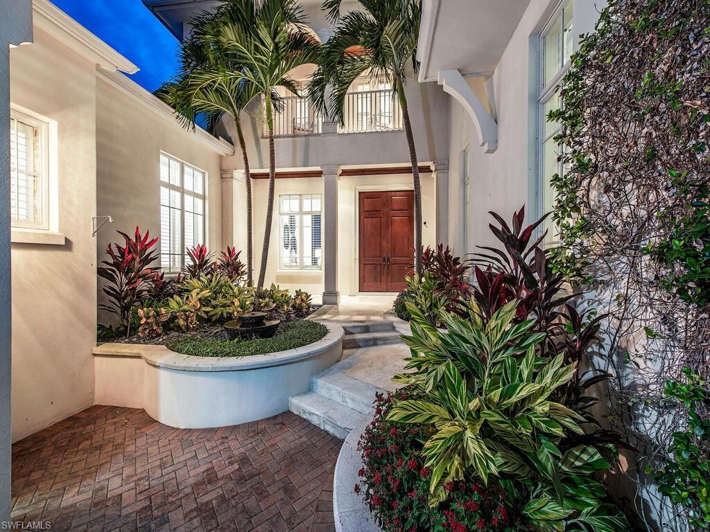 One of Naples original boating communities, Royal Harbor is the ideal locale for boaters given its close proximity to the Gulf via direct access. The community is minutes from Naples’ renowned  5th Avenue South shops and restaurants and Naples pristine beaches! Being so close to downtown Naples ensures you won’t miss out on any of the fun activities or events that take place during season. After a day out on the water, at the beach, or in town, you can come home to relax outdoors; lounging poolside or under the covered patio with wood ceiling.
This 4,400 square foot home features a gourmet kitchen with gas appliances and custom built cabinetry, beamed ceilings, travertine floors, and open floor plan. 3 car garage w/ a car lift is perfect for the car lover! The first floor of this residence also offers a 2 en suites .  What a great view from the upstairs master suite with its own terrace to watch the dolphins, custom closets, and a spa like oasis in the master bath.