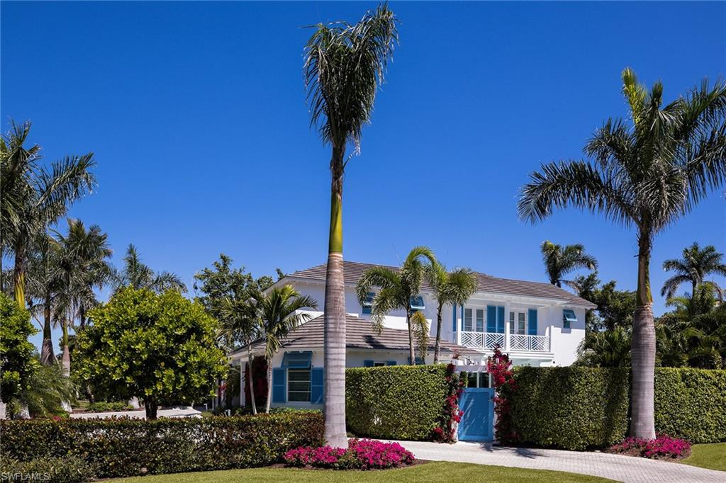 Only three blocks to the tranquil Gulf beaches, this Caribbean inspired residence has a stunning contemporary interior boasting 4,267 square feet of relaxing and luxurious living area. This artfully designed residence was penned by the renowned Naples' architect, Jerry De Gennaro and constructed to the exacting standards of A. Vernon Allen Builder in 2013. The open, airy floor plan has soaring ceilings that fill the chef's kitchen and beautifully appointed living and dining spaces with glorious natural sunlight throughout the day. The first-floor master suite with large bath and dual closets opens to the privately and tropically landscaped pool area. Three additional en-suite bedrooms, private office, outdoor kitchen, two-car garage, retractable screens, make this a true gem in a very desirable Old Naples location.