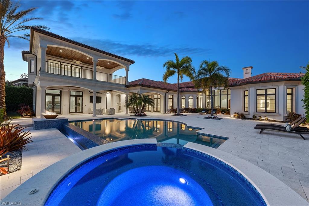 Situated on an oversized lot with southern exposure, overlooking open fairways to the 15th hole of the exquisite Norman/Dye designed golf course, this Prato Grande Estates home in Talis Park has more than just breathtaking views. The home was recently updated with a beautifully neutral palette and new AC units in 2020. Each of the five oversized guest bedrooms has its own en-suite, including two VIP suites with private entrances. The upstairs suite features a kitchenette, office or sitting area and an expansive balcony with a stunning view. The huge master suite offers a morning kitchen, walk-in shower and jetted soaking tub. Additional interior features include marble flooring, billiards room, gourmet kitchen, powder room, two gas-burning fireplaces and private office. The outdoor area is adorned with stone pool decking, infinity-edge pool, spa, fire bowl, fireplace, built-in grill and outdoor shower. Don't miss your opportunity to enjoy a private beach shuttle and Talis Park's top-of-the-line amenities - The Vyne House clubhouse with 4 dining venues, professional golf, tennis/fitness staff, 6 Har-Tru lighted courts, yoga/pilates studio, bocce, 2 pools/spa & concierge services.