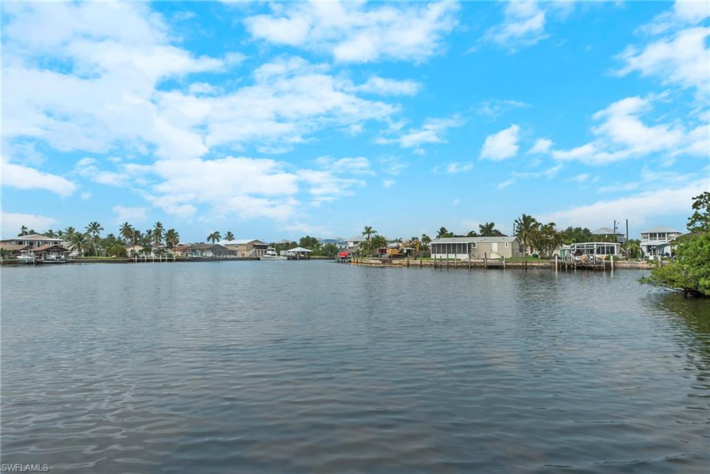 50 ft. of waterfront with deep-water direct access, dock with 10,000 lb. lift.  A true diamond in the rough with so much potential for your get-a-way cottage; close to everything you want including world class fishing and beaches within minutes. It’s move-in ready now but with some ingenuity could be quite charming with huge porch, hardwood floors, and bay windows. Lower level of 900 sq ft has plenty of storage area, perfect space for a workshop, and laundry hook-ups.  Seller is firm on price.