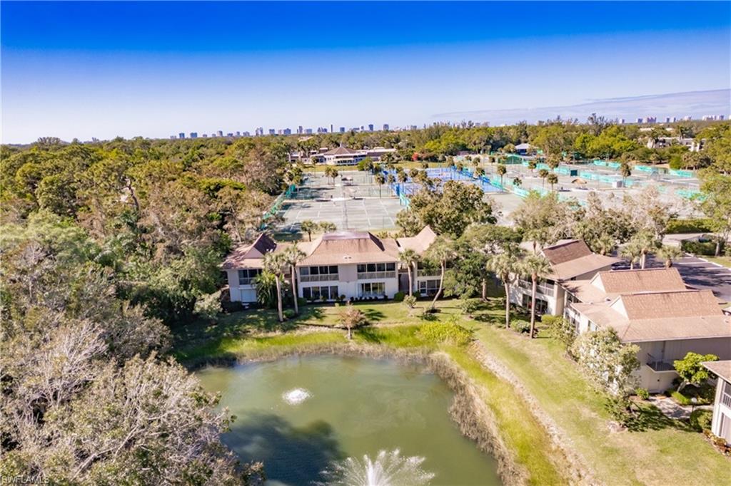 This charming 1-bedroom, 1-bathroom condo is less than 4 miles from Naples' stunning beaches and offers serene water views of the lakes from the living and dining areas, as well as the bedroom. Surrounded by mature landscaping, the lush tropical setting creates a true Floridian oasis. Conveniently located in central Naples within the Naples Bath & Tennis community, this home is west of Airport-Pulling Road and just a short walk to Publix, Target, A-rated schools, the YMCA, fine and casual dining, entertainment, and more. Lovingly maintained by its owners, this condo is move-in ready and a must-see!