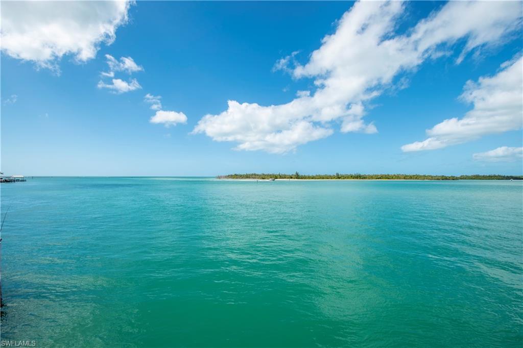 Rare opportunity to own a one-of-a-kind estate, overlooking the Gulf of Mexico. The main residence is 4,321sq.ft. under air and has 5 bedrooms, 4 bathrooms with an elevator. The guest house is 1,426sq.ft. under air and has 2 bedrooms, 2 bathrooms.  Take a swim in the heated swimming pool & relax in the spa as you soak up the sun while you watch the dolphins & manatees play in your back yard. There are 2 docks, 2 boat lifts and a boat house with observation deck on top. Panoramic views of the Gulf of Mexico, Cannon Island, The Intracoastal Waterway and Big Johnson Island. Enjoy excellent fishing off the dock, instant access to the Gulf and breathtaking sunsets! Isles of Capri is a tropical island that boasts and abundance of wildlife, four great restaurants and three marinas. Located one mile from Marco Island & only 20 minutes away from Downtown Naples with its sophisticated shopping & five star dining. Our area is famous for its white sand beaches, world class fishing & boating and fantastic golfing. Capri is the perfect place to sit back, relax, unwind and let the sights, sounds and smells sooth your mind, body and soul.