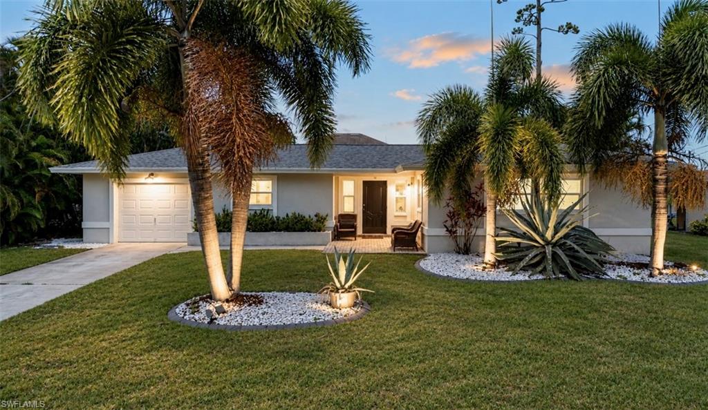 WATERFRONT PARADISE AWAITS! Experience the pinnacle of Southwest Florida waterfront living with this exceptional TURNKEY-FURNISHED Gulf-access home in Cape Coral’s coveted Yacht Club District, positioned less than one mile from open water. Showcasing coveted WESTERN EXPOSURE and breathtaking sunset views across the canal, this property is perfectly positioned for boaters seeking quick access to open water, waterfront dining, world-class fishing, and Southwest Florida’s renowned island destinations. A HEATED POOL, private composite dock, and 10,000-lb boat lift complete this exceptional waterfront retreat. As an added incentive, the seller is willing to include THE BOAT with an acceptable offer.

Surrounded by lush tropical landscaping, the property delivers a private resort-style setting designed for both relaxation and sophisticated entertaining. The expansive covered lanai overlooks tranquil waterfront views, offering an exclusive retreat with exceptional privacy. Inside, the thoughtfully updated open-concept interior blends refined coastal elegance with modern comfort. Luxury vinyl plank flooring, quartz countertops, white shaker cabinetry, stainless steel appliances, plantation shutters, beautifully renovated baths, and designer furnishings create a polished, move-in-ready experience. A spacious guest wing provides versatile accommodations for visitors, a private office, media lounge, or wellness space.

Impact-resistant windows and doors enhance security, energy efficiency, and natural light throughout the home, while recent capital improvements—including a new roof (2023), dock and decking (2024), pool heater (2024), water heater (2024), and vinyl fencing—offer long-term value and peace of mind. Transferable flood insurance is available.

Ideally situated moments from Yacht Club Beach, the fishing pier, boat ramp, waterfront dining, downtown Cape Coral, and Fort Myers, this residence combines an elite waterfront location with exceptional lifestyle appeal. With direct Gulf access, extensive upgrades, turnkey furnishings, and a proven vacation rental history with potential transferable bookings, this is a compelling opportunity for luxury waterfront enjoyment and strong investment potential.