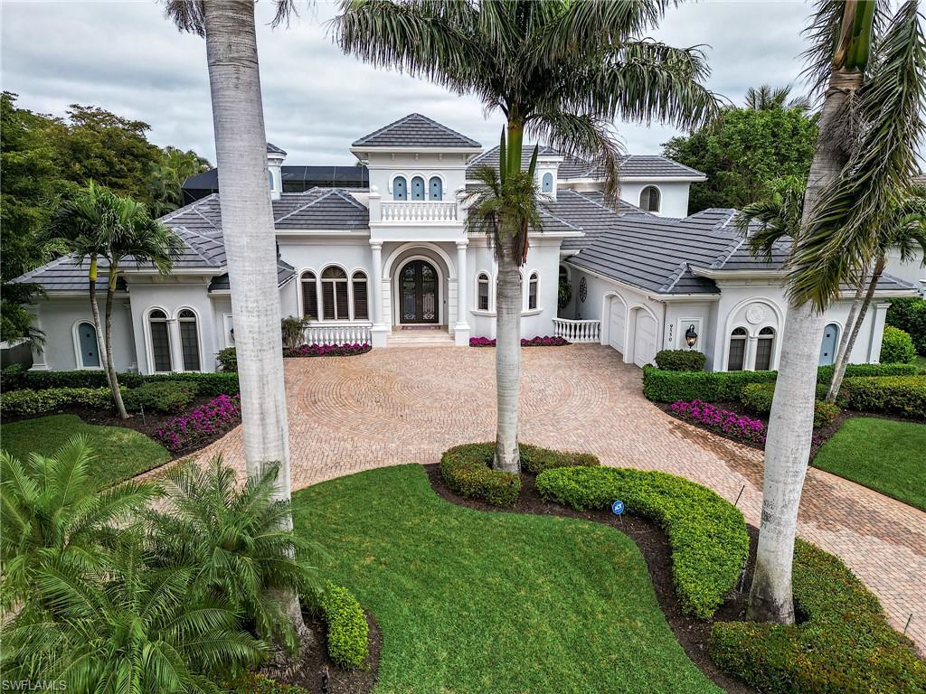 SKIP the waitlist and head directly to the tee box, with the option to buy a full golf membership with this spectacular Frey & Son home in the exclusive Lake Forest neighborhood in Shadow Wood. Enjoy a cocktail on your balcony with truly one of the best property views of lake, #10 North, #18 North and yet another lake. Located in the peaceful center of Shadow Wood, this estate home is one of a kind. Newly painted, new roof 2023, natural gas provides power protection with a whole home generator and heats your huge pool and spa. The lanai will cinch this for an elite buyer—a massive space with outdoor kitchen, huge sun-drenched spaces, as well as a covered area which is received from the family room by a massive 90 degree set of sliding glass doors. Two garages, 2 and 1 car. Master bedroom suite includes a closet that is easy to get lost in. Kitchen updated with quartz counters. Walk-in pantry, as well as an adjacent room for wine and other storage. Upstairs guest suite includes a salon with wet bar, bath with double sink and that gorgeous balcony view. Fiber to the home provides lightning fast internet and television.  Member owned Shadow Wood Country Club offers 54 holes of championship golf, 2 club houses, 9 Har Tru tennis courts, bocce, outdoor fire pits, access to a private beach club, fitness center, full-service spa, pickle ball, and private restaurant. New Lifestyle Amenity Center will add 2 resort style pools with zero-depth entry, lap lanes and dedicated kids pool, poolside restaurant & bar, 6 indoor pickleball courts, new racquet pro shop and a grab & go cafe.  Great location close to shopping, airport, beaches and much, much more.  THIS HOME IS A MUST SEE!
