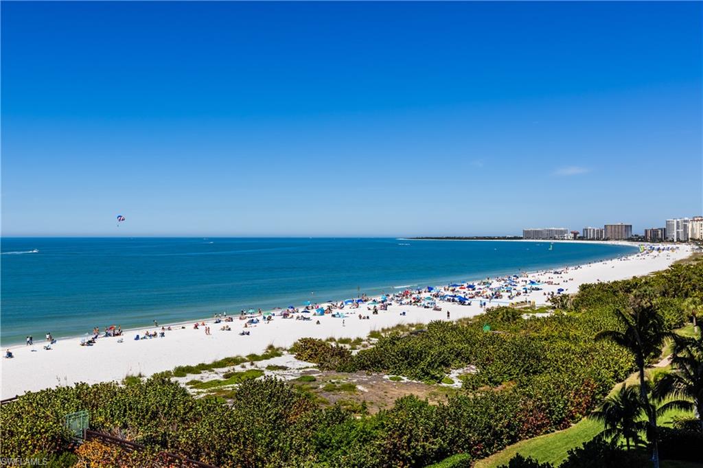 This stunning residence offers all the luxury you desire. Exceptional views of Marco Island's crescent shaped beach & the Gulf of Mexico. One of the most sought-after floor plans in Marco Island's premier building. This ''03'' Floor plan has been professionally modified & decorated. Recent renovations to this unique 03 unit include updating the Kitchen & Master Bath with steam shower. The interior has been refreshed with the finest furnishings and accessories. Wood plank flooring, slate floors, custom lighting, and a fabulous private entry foyer with a water feature add to the charming interior. The spacious 4 bedroom, 4 bath is one of the largest Veracruz units with 3,846 sq. ft. Located within the private gated Community of Cape Marco, the Veracruz best in class amenities include: luxurious bar areas, billiards, movie theater, fitness center, two pools, sauna, BBQ area, extra storage, two assigned parking spaces, guest suites and tennis center. Offering large west and east facing terraces providing sweeping views, while enjoying sunrises and sunsets.