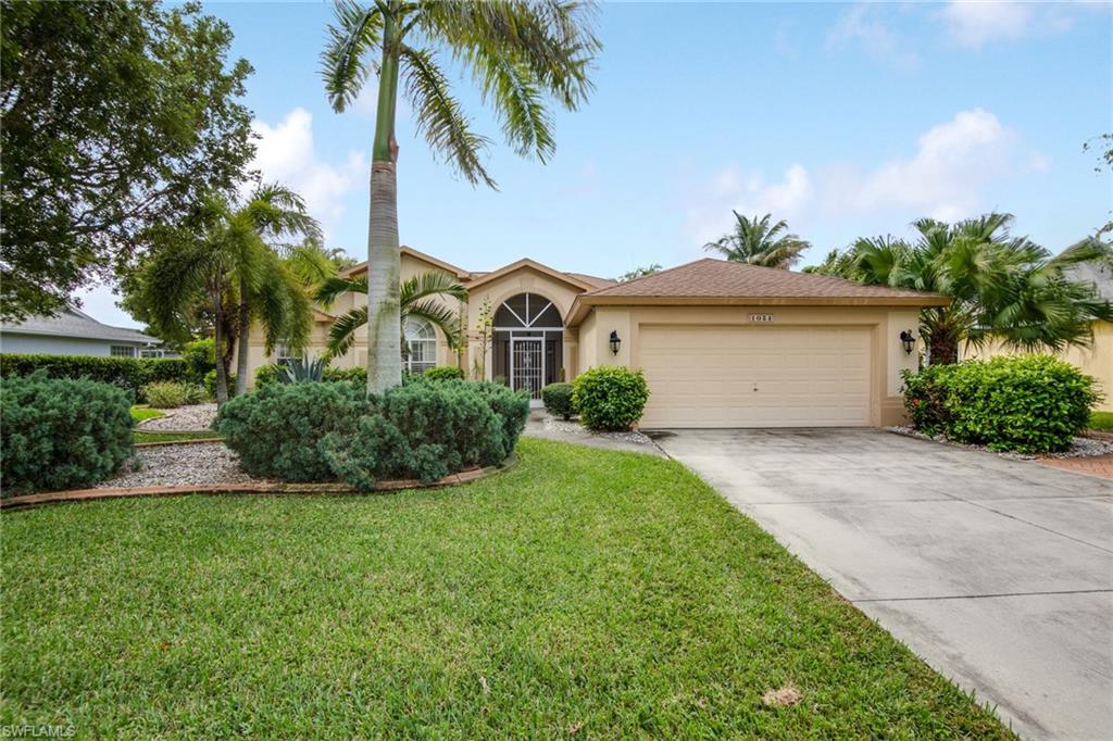 Wonderful southern exposure 3 bedroom 2 bath pool home in Rosegarden neighborhood. This elegant home comes fully furnished and equipped. The cathedral ceilings and open floor plan make this home feel larger than it is. This home features a split bedroom floor plan, plant shelves, spacious kitchen with a large breakfast bar and overlooks the dining area and the pool beyond that. The tile and wood like flooring are easy to maintain. The solar heated pool and additional open patio offer tranquil views of the lake behind the home. There is ample storage space and a inside laundry room. This home offers a wonderful Rosengarden location which allows for easy access to Tarpon Point Marina and for dinner, shopping, boating, etc. There are also sidewalks along the tree lined street. this home is also close to rotary park where your dogs can make friends. This home has been a very successful vacation rental. Due to seasonal rentals we appreciate your understanding and cooperation for showings.