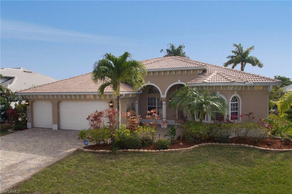 You won't find many like this one!  Bring your most discriminating buyer's to this extraordinary, Custom 4 Bedroom and 4 Bath Gulf Access pool Home, with 3 car garage located in popular SW Cape Coral!  This outstanding home features a gourmet kitchen with black walnut and maple cabinetry, granite counters, kitchen island with sink & wine rack, built-in desk, Pure Water Systems filtration, stainless steel Fisher/Paykel double oven and Kitchen Aid appliances! This luxurious home offers the finest craftsmanship with soaring, coffered and lighted ceilings throughout, 20" neutral tile, pocket sliders to the lanai, plantation shutters,  electric blinds and over 3,400 sq. ft. of living space!  The spacious master bath features a walk-in shower with multiple shower heads, garden tub and his and her sinks with granite counter and the master bedroom features 3 windows overlooking the canal, French Doors to the pool and  two huge walk-in closets with shelving!  The oversized pool features a spill-over spa, landscaping and a huge paver deck area.   Park your boat on the 5,000 lb. lift with u-shaped dock with maintenance free composite decking! Zoned AC units new in 2018 & 2020!