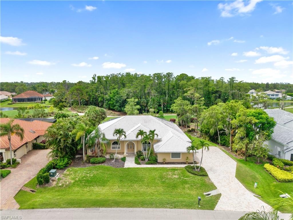 Exceptional opportunity in Fiddlesticks Country Club! Positioned on a premier lot overlooking the 13th hole on the newly improved Loch Ness Course, this residence offers panoramic golf course views, stunning from the main suite, living area, breakfast nook, and guest bedroom. Major updates include a newer tile roof, a Generac propane whole-home generator, automatic hurricane roll-down screens around the pool, and newer equipment for the heated saltwater lap pool and spa. The newer expanded paver driveway leads to a 2-car plus golf cart garage. Inside, nearly 3,000 sq ft offer a versatile split floor plan, 3 bedrooms plus a den (or a 4th bedroom)/ a real wood-burning fireplace at the center of the home. The large covered lanai with pocket sliders creates seamless indoor-outdoor living. The main suite is a large private suite with his-and-hers closets & also offers access to the pool, while a dedicated pool bath on the guest side ensures a true split layout. Tall ceilings and an open concept offer endless possibilities, with exterior landscaping ready for revitalization. With Fiddlesticks’ championship golf, where 36 Holes of Championship Golf Are Always Within Reach, tennis, fitness, dining, and a vibrant social calendar, this is a rare chance to secure a premier home. Add your cosmetic touch and make it your own! Please note that one or more images have been rendered to illustrate examples of how the property could look.