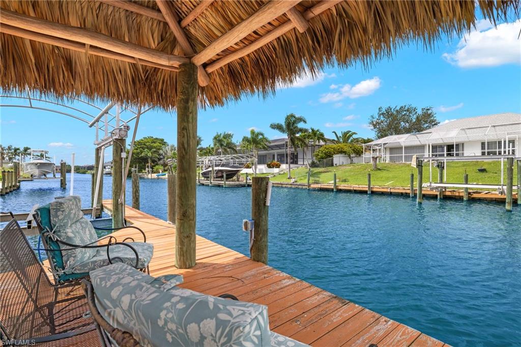 This is a VACATION RENTAL only. Owner will not consider annual rentals. Weekly rentals are welcome.
Villa Aleena is a 4-bedroom, 3-bathroom property on intersecting gulf access canals with a saltwater electric heated pool and hot tub. This home sleeps a maximum of 8 guests (including children) and will accommodate up to 2 pets that do not exceed a combined weight of 35 lbs. Please inquire about possible pet exceptions.

· · · · · PROPERTY PERKS · · · · ·
- Pet friendly
- Hot tub
- Saltwater pool
- Kayaks
- Bicycles
- Tiki Hut
- Pool table
- Recliners

· · · · · LOCATION · · · · ·
- Located in Southeast Cape Coral
- Close to Horton Park & Boat Ramp
- Close to Four Mile Cove Ecological Preserve
- Close to Del Prado Blvd. with plenty of dining & shopping
- A short drive to Midpoint Bridge which leads you to Fort Myers/Fort Myers Beach

· · · · · LIVING AREAS · · · · ·
- Flat-screen TV
- Comfortable seating
- Electric fireplace
- Game room with theater recliner seats, pool table, high top bar & flat-screen TV

· · · · · KITCHEN & DINING · · · · ·
- Fully equipped
- Dining area with seating for 6
- Additional room for 2 at breakfast bar in kitchen

· · · · · BEDROOMS · · · · ·
- Primary Bedroom: King bed & flat-screen TV
- Secondary Suite: King bed, french doors to pool, flat-screen TV & attached bathroom
- 2 Guest Bedrooms: 1st has a Queen bed & flat-screen TV, 2nd has two Twin beds & flat-screen TV

· · · · · BATHROOMS · · · · ·
- Primary Bathroom: Soaking tub, walk-in shower & dual-sink vanity
- Secondary Suite Bathroom: Shower & doubles as the pool bathroom
- Guest Bathroom: Shower/tub combo

· · · · · OUTDOOR LIVING · · · · ·
- Saltwater electric heated pool
- Stand alone hot tub
- Northern pool exposure
- Dining area with seating for 6
- TV on the lanai
- Sun loungers
- Grill
- Tiki hut on boat dock
- Boat dock & lift

· · · · · THIS HOUSE IS GREAT FOR · · · · ·
Boaters with families looking for a gulf access home with a hot tub and plenty amenities included