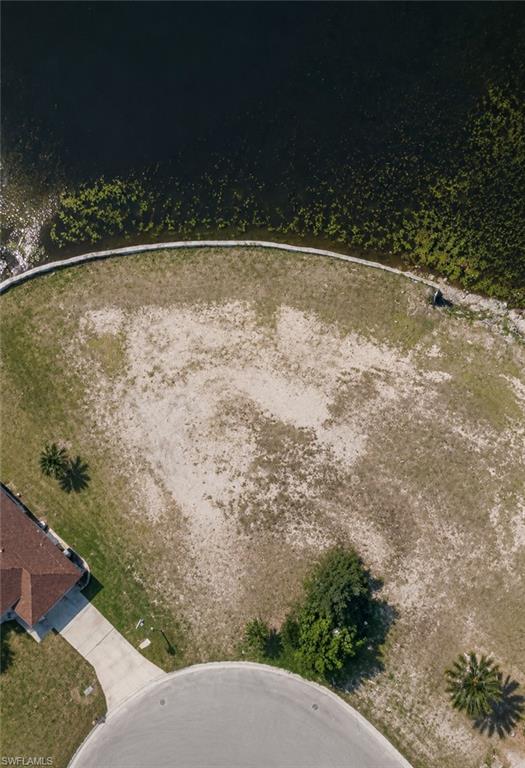 Build your dream home on this oversized freshwater lot featuring a newer seawall and breathtaking wide lake views! This exceptional property offers plenty of space for a custom home, pool, and dock, allowing you to fully enjoy Florida waterfront living. Conveniently located with easy access to shopping, dining, schools, and entertainment, this lot combines tranquility with everyday convenience. Situated on city water and sewer with all assessments paid, and located outside of a flood zone for added peace of mind. Don't miss this rare opportunity to secure a premium waterfront homesite with stunning views and endless possibilities!
