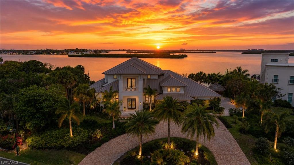 Experience one of Southwest Florida's most extraordinary waterfront residences, where luxury, privacy, security, and breathtaking natural beauty come together on the exclusive gated peninsula of Key Marco.

Perfectly positioned to capture some of the most spectacular sunset views on Marco Island, this custom-built estate offers an unmatched combination of sophisticated design and exceptional engineering. Every evening, enjoy panoramic western skies painted in brilliant shades of orange, pink, and gold while overlooking pristine water and protected preserve—creating a peaceful setting that feels worlds away from the ordinary.

Built with resilience in mind, this remarkable residence features a FEMA-approved reinforced panic room, offering an exceptional level of safety and peace of mind rarely found in luxury homes. Beneath the home is a fully engineered basement equipped with multiple sump pump systems, while the basement floor sits approximately 15 feet above sea level, providing a unique combination of accessibility, storage, and thoughtful construction uncommon in coastal Florida.

Inside, the home showcases refined craftsmanship, soaring ceilings, designer finishes, expansive living spaces, and seamless indoor-outdoor entertaining. Walls of glass frame stunning water views throughout the home while inviting natural light into every room. The open-concept floor plan is ideal for both elegant entertaining and comfortable everyday living.

The outdoor living experience is equally impressive, with generous covered lanais, a resort-style pool and spa, outdoor entertaining areas, and tranquil waterfront surroundings designed to embrace the Florida lifestyle. Whether enjoying your morning coffee with dolphins passing by or ending the day watching Marco Island's famous sunsets, every moment here feels extraordinary.

Located within the prestigious community of Key Marco, residents enjoy the privacy of one of Southwest Florida's most exclusive neighborhoods—a secluded, secure, gated peninsula surrounded by protected waters and natural preserves. With limited access, quiet streets, and exceptional security, Key Marco offers a level of serenity rarely available in today's luxury market.

Adding even more convenience for families, one of the area's most respected charter schools is located immediately outside the community gates, providing exceptional educational opportunities just moments from home.

This property offers the best of Florida living—boating, spectacular sunsets, unmatched privacy, exceptional security, and luxurious comfort—all within minutes of Marco Island's world-renowned beaches, fine dining, shopping, golf, and the Gulf of Mexico.

This is far more than a home—it is a private waterfront sanctuary engineered for peace of mind and designed for an unparalleled coastal lifestyle.