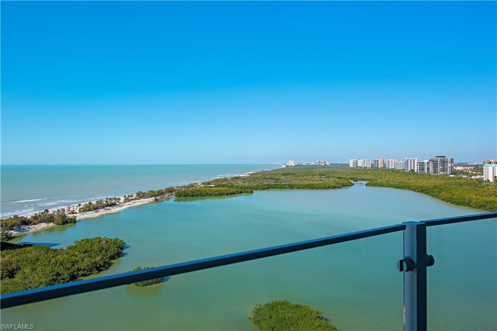 One or more photo(s) has been virtually staged, AI generated or rendered.  Welcome home to one of the most amazing views in all of Naples. Sweeping water vistas as far as the eye can see from the huge bay below out to the beach, and the winding coastline all the way up to Sanibel Captiva. Forever sunsets are the hallmark of this incredible cloud nest in the sky with the beach calling your name. Only a short stroll to the beach and your feet are in the sand. The interior if this gorgeous home is clean, modern, and  contemporary with 9 ft. ceilings, Leicht custom cabinets, top of the line Thermador stainless appliances, induction cooktop, custom closets, custom molding, custom trim and doors, and hand selected Taj Mahal quartzite countertops throughout. Baypointe is a luxury tower offering superb resort amenities with 3 guest suites, amazing renovated sundeck, sunny pool and spa, beautiful social gathering areas, caterers kitchen, state of the art fitness center, kayak ramp and close easy beach access. This pet friendly high rise allows 2 pets.  Gated and secure with 24/7 manned guard gate. Close to upscale designer shopping, dining, and entertainment at Venetian Village, Waterside Shops, Artis-Naples, Mercato and downtown Fifth Ave and Third Street just a few minutes drive to the south. This is the Best of the Florida Lifestyle.