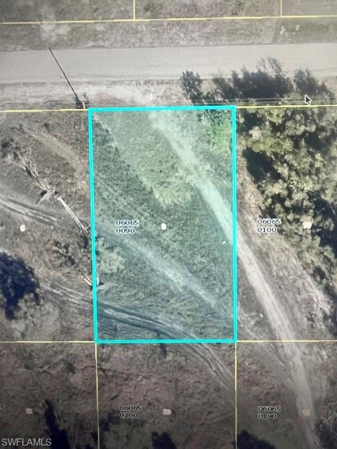 Located minutes away from Daniels Parkway this single-family lot is ready to be built on. Welcome to the booming Southwest quadrant of Lehigh Acres! This prime 0.26-acre parcel offers the perfect backdrop for your Florida dream lifestyle. Positioned in a quiet, rapidly developing neighborhood filled with beautiful new construction homes, this property gives you the freedom of no HOA fees or restrictive community rules. Enjoy the ease of a fully paved public road with electricity and cable infrastructure already available at the street level.Conveniently located with quick access to State Road 82 and major thoroughfares, commuting into Fort Myers, regional airports, or the area's top beaches is a breeze. Local shopping centers, grocery options, and schools—such as Gateway High School—are just minutes away. Whether you are an investor looking to capture value in Southwest Florida’s hot market or a buyer ready to build a custom retreat, this property is an exceptional find!