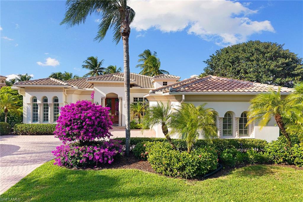 Set in the prestigious gates of Grey Oaks Country Club, this elegantly updated residence offers a rare blend of serenity, privacy, and timeless sophistication. Tranquil lake and botanical island views create a stunning backdrop, while the home’s setting, free from neighboring residences to the north, south and east, ensures exceptional privacy. The thoughtfully expanded three-bedroom-plus-study floor plan reflects meticulous attention to detail, featuring an additional guest suite closet, a newly created utility room and a fully air-conditioned golf cart garage seamlessly integrated with the two-car garage. Entertaining is elevated by a beautifully reimagined butler’s pantry, offering generous storage and effortless flow. At the heart of the home, the kitchen showcases quartz countertops, refined backsplash, updated fixtures and premium appliances including refrigerator/freezer, dual dishwashers, double ovens, cooktop, warming drawer and Sub-Zero wine storage, opening gracefully to the family room. Outdoor living is equally compelling, with a screened travertine lanai enhanced by warm wood ceiling accents, ideal for entertaining or quiet reflection amid serene views. Additional features include a whole-house generator, electric storm shutters on the front entry and sliders, tankless water heater, new roof (2021), and fresh interior and exterior paint. Grey Oaks Country Club offers an unparalleled lifestyle with two clubhouses, 54 holes of championship golf, a 30,000-square-foot wellness center, a 450-seat Pool Café, and world-class tennis, pickleball and bocce facilities, all in a prime Naples location close to beaches, dining and shopping.