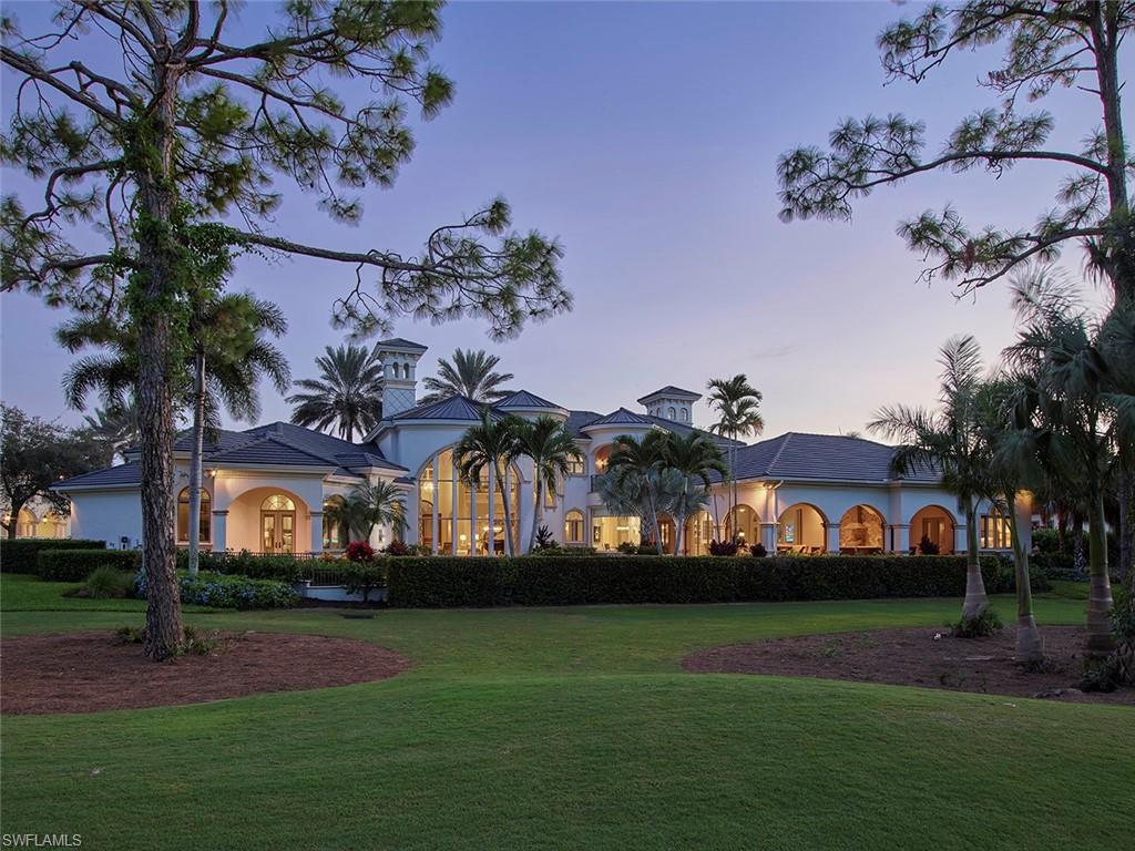 Newly renovated and freshly styled this transitional estate home sprawls along the 10th fairway offering panoramic and private views from nearly every room. Be greeted with soaring ceilings and an abundance of natural light through the copious amount of glass throughout. The dreamy kitchen is perfection, featuring double islands with fully inset custom cabinetry, thick porcelain slab countertops, Wolf, SubZero & Miele appliances and plentiful storage.  All ideally positioned with entertaining in mind, with easy access to the stylish bar, formal dining area and generous screened in lanai with sophisticated summer kitchen. The peaceful master suite offers a charming sitting area, amazing closet and spa like bath. Additional notable features include new Lutron lighting with LED lights, whole home Sonos system, refurbished resort like pool and spa, 4 car garage, new roof in 2021 and an easy living floorplan conveniently designed with the master, 2 guest rooms and a study all on the first floor. Whether a seasonal resident or full-time family, 9671 Mashie Ct. checks all the boxes and lies in one of Naples most prestigious communities with world class amenities and offerings.