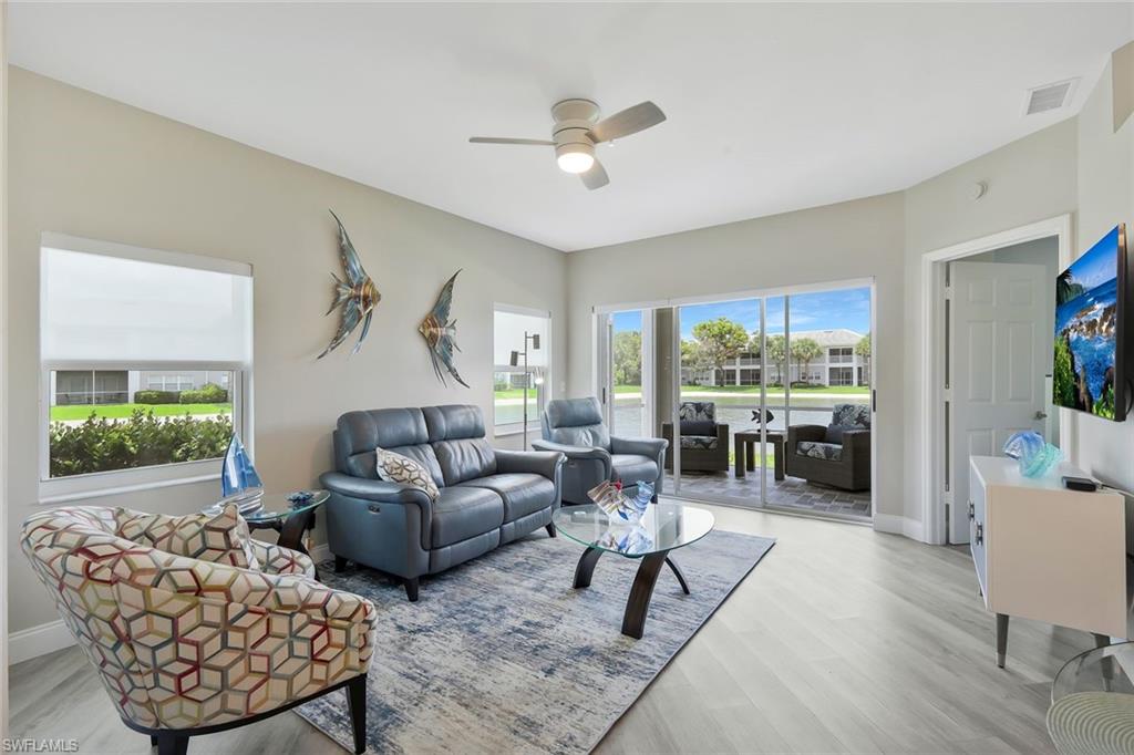 Model Perfect Corner 2 Bedroom/2 bath First Floor Condo is located much further south after the Gateway Golf and County Club area in Summerwind. Memberships to the Golf and Country Club are optional. Enjoy the convenience of a guarded gate entry in Gateway, just 6 minutes from the airport without the noise. This lovely corner condominium has been updated throughout. Upgrades and Features include quartz countertops, newer stainless steel appliances, New luxury vinyl flooring, fresh custom interior paint, tiled lanai, IMPACT WINDOWS, and Electronic storm shutters on the screened lakefront lanai, newer AC and water heater, luxury window treatment, and modern fans/lighting. The Primary Suite is light and bright yet relaxing and peaceful with luxury window treatments. The Primary bath is fully updated, down to the water closet, with new fixtures. Your guests will enjoy the second bedroom and bath with a tub /shower combo to fit all guests of all ages. Relax on the screened lanai and enjoy the lake's water feature. All residents in Summerwind enjoy a community pool and spa just steps away.  As a resident in the Gateway area, all owners have access to a larger community pool and sports fields.  Gateway Golf and Country Memberships have no waiting list and can be purchased as a full golf or a social membership to enjoy the club dining, pool, and pickleball.  This condo is available for immediate occupancy for a seasonal, full-time, or even investment property.