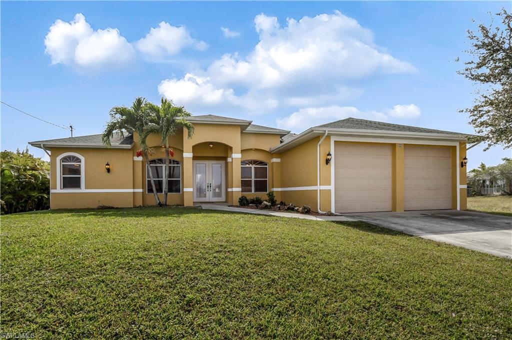 Single family home situated in the NE corridor of Cape Coral in a non-gated neighborhood, this beautiful home features a fantastic waterway view from the screened lanai and spacious backyard. You'll love the large full kitchen, brand new stainless steel appliances, split bedroom floor plan, large- open living room with plant shelving, screened lanai, and plenty of room for a pool. Home features a new dock, new air conditioner, and a new water treatment system for the house. Surrounded by single family homes and close to all main roads, shopping, and restaurants. In just a short drive you can be in the Fort Myers River District, enjoy the Island life of Matlacha/Pine Island, or cooling off from the SWFL heat at Sun Splash Waterpark in Cape Coral.