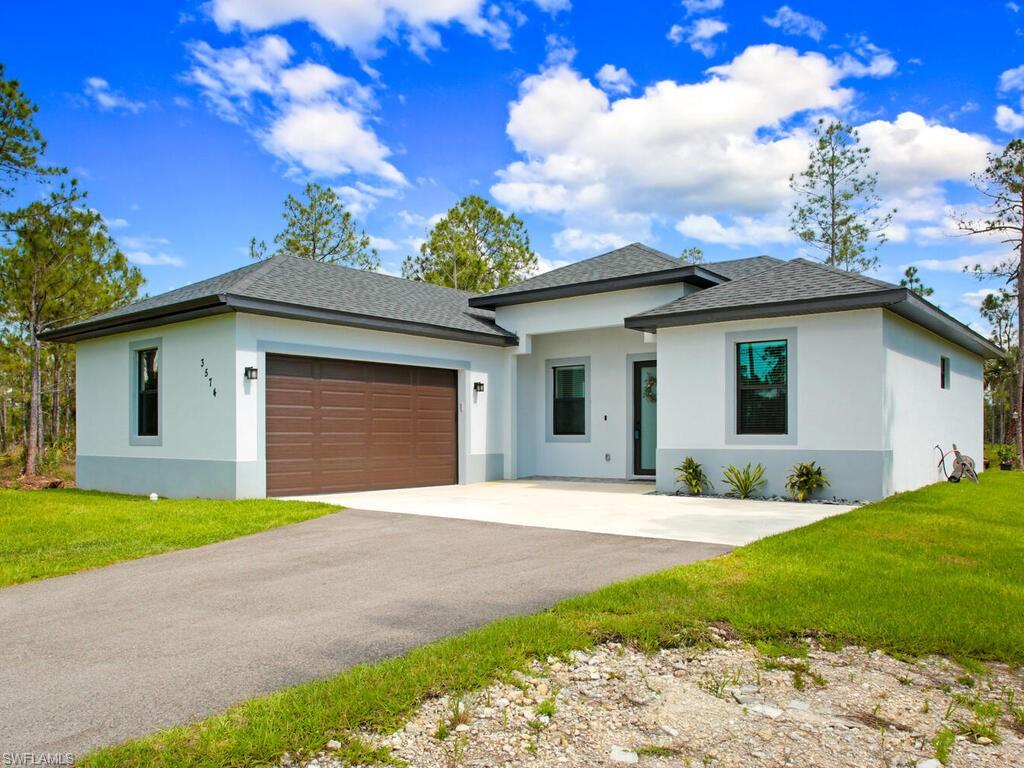 Located on 1.14 acres in Golden Gate Estates. This is a great opportunity to own a 3 bedroom 2 bath home built in 2021. This home features open living and dining room area, 8ft doors throughout, split bedrooms, large walk-in closet in master, tray ceilings in the master, stainless steel appliances, granite counter tops, impact windows & doors, tile floor throughout, screened in lanai, long paved driveway, and much more. The land has been cleared and a firepit installed making it perfect for enjoying quality family time in the private and tranquil country lifestyle of Golden Gate Estate. A few other notable upgrades include: WIFI Sprinklers and garage door opener, ring doorbell, & LED lights above cabinets. Entire home is nicely maintained and cared for with plenty of land for you to enjoy.