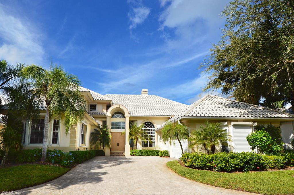 V.2196 - Dynamic long lake views and carefree living in this beautiful luxury villa. From the “wow” lake view when you enter the front door, the spacious floor plan flows easily from all areas of the home to the tropical lanai with rock waterfall.  Delight in the 3 bedrooms, expansive den with built-in cabinets and shelves, 4.5 baths, volume ceilings, abundant natural light, large tile, wood and carpet floors. Updated kitchen with island, granite counter tops, built-in wine cooler, adjoining butler's pantry and spacious family room open to the kitchen and lanai.  The second level guest area features 2 guest bedrooms each with en suite baths and adjoining sitting area.  The resort style sunny lanai boasts a heated pool and spa and an outdoor kitchen with gas grill.  Home has a 3 car garage and hurricane protection on most openings. For carefree living, the Sanctuary HOA has responsibility for exterior landscaping and weekly pool care.